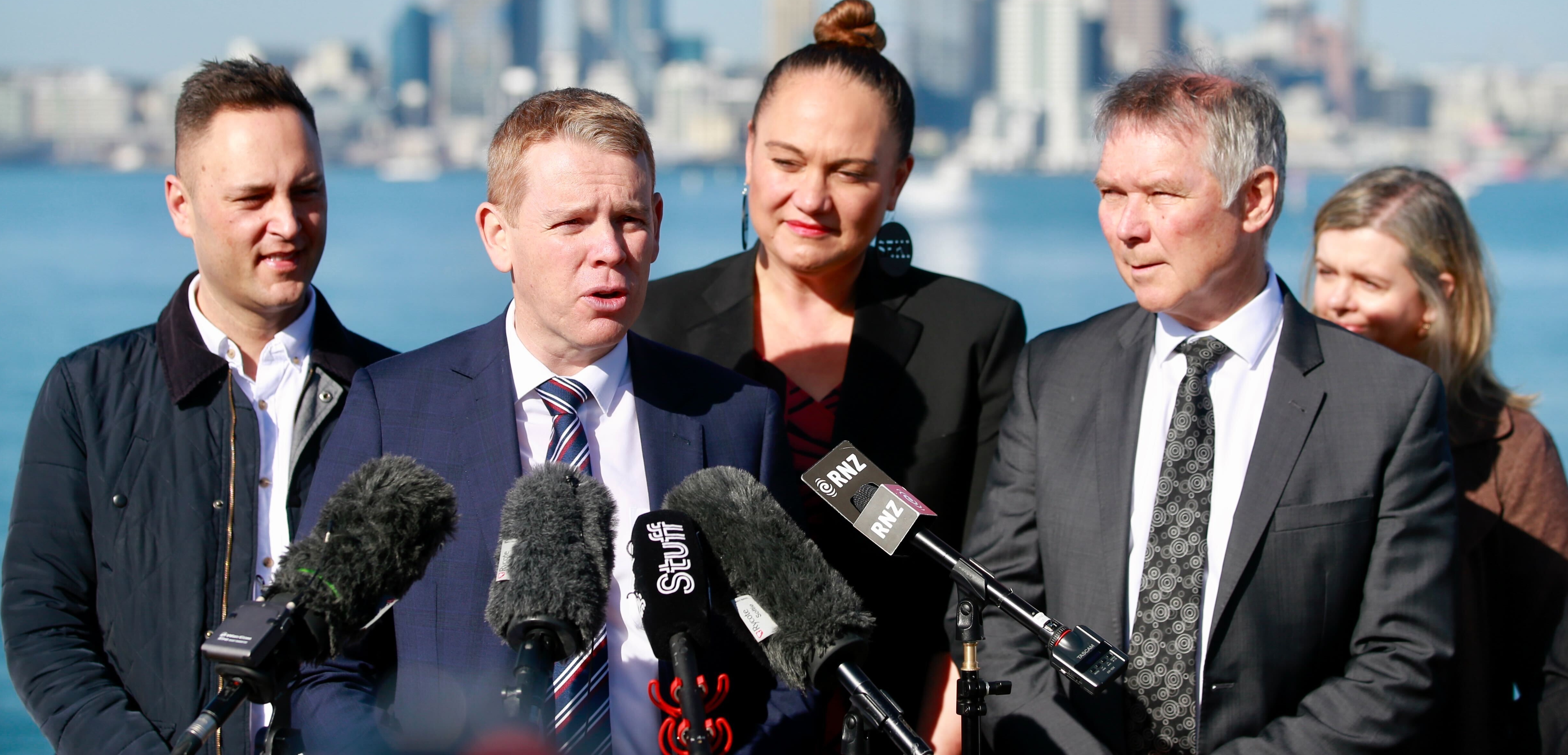 Prime Minister Chris Hipkins with Transport Minister David Parker and other MPs announcing decisions around a future harbour crossing. Photo / Alex Burton