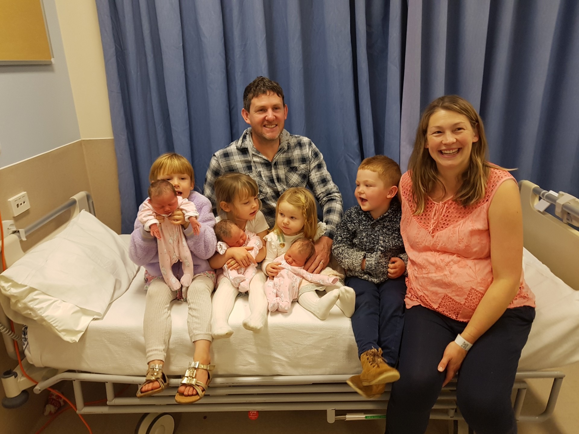 Anna and Jeremy Pyle with their seven children aged under seven - Eliane, 6, Georgia, 3, Olivia, nearly 2, and James, 4, with their new identical triplet sisters Sophia, Adeline and Gabriella.