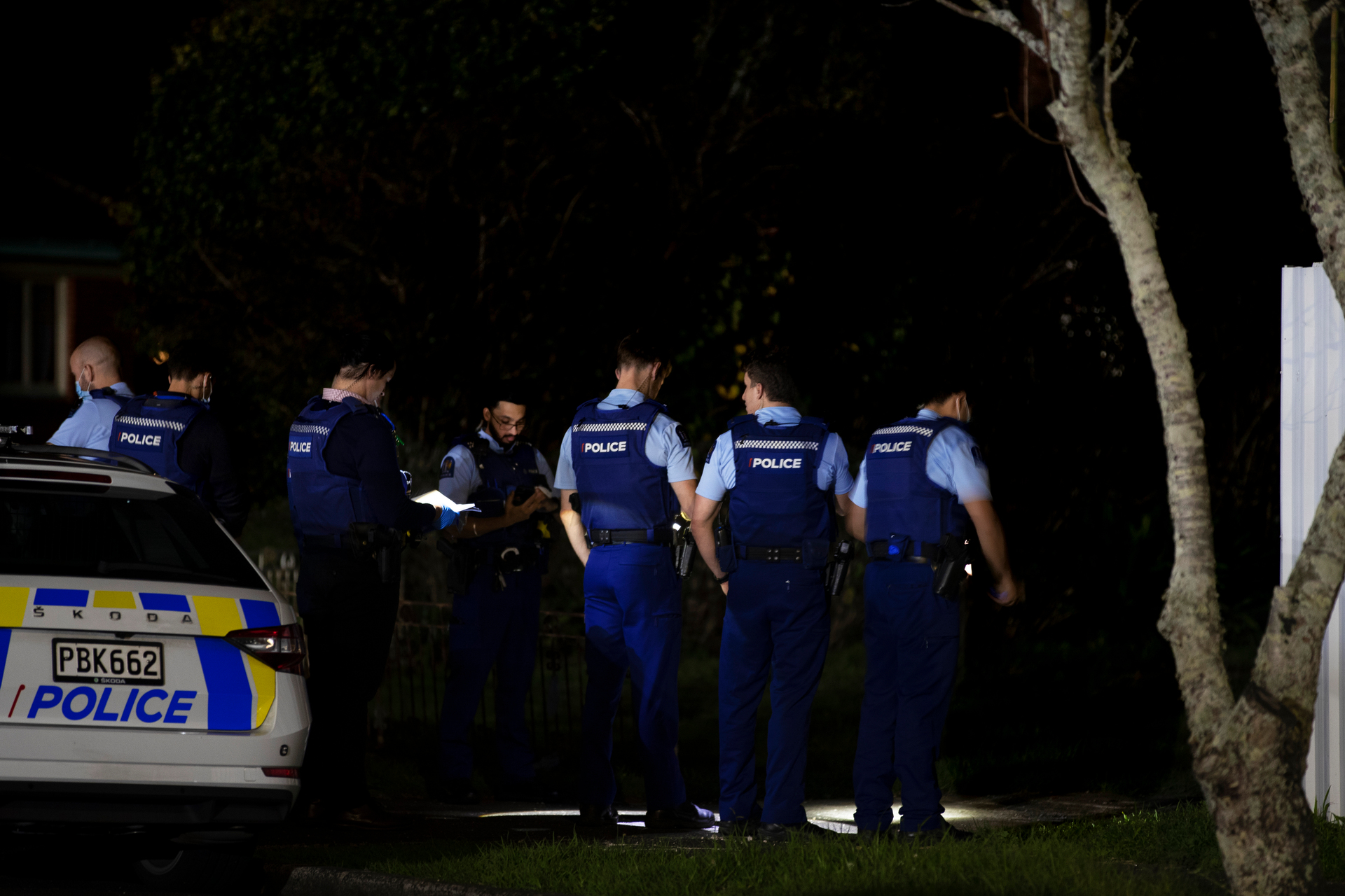 Police attend the scene of a shooting after a person was injured when a home was sprayed with bullets. Photo / Hayden Woodward