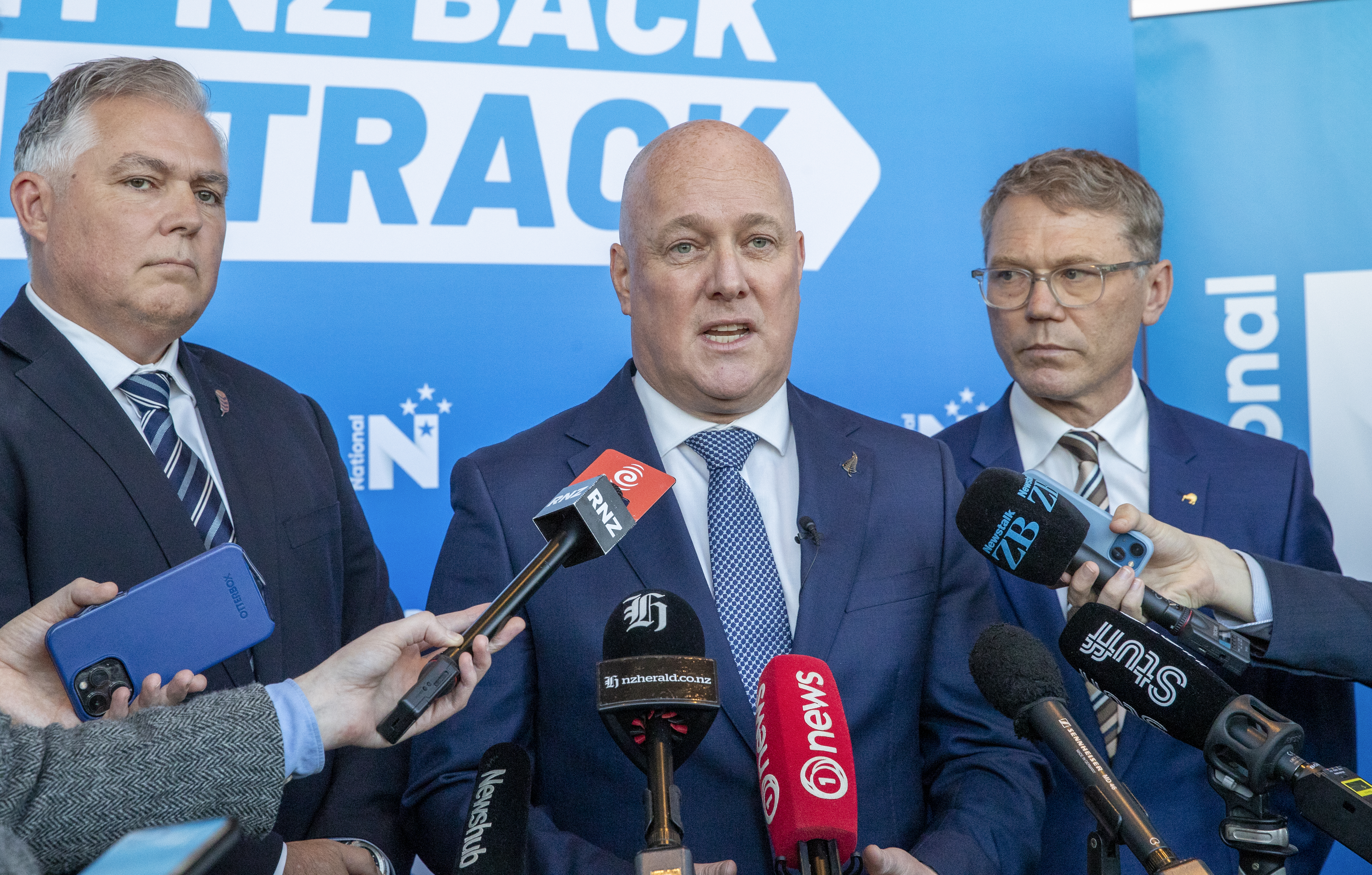 Prime Minister Christopher Luxon (centre), flanked by Police Minister Mark Mitchell (left) and Justice Minister Paul Goldsmith. Photo / Mark Mitchell