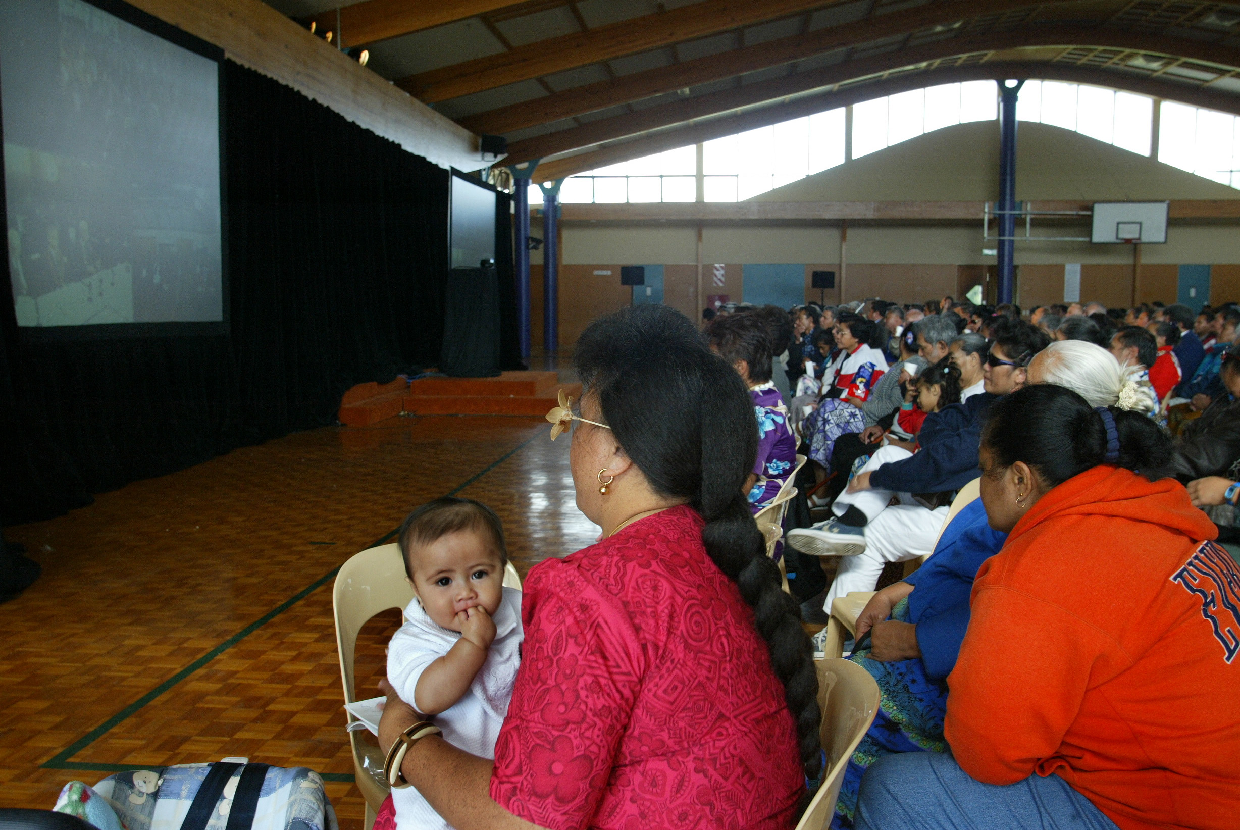 A six-month-old Aigagalefili Fepulea'i-Tapua'i, held by mum Laisene Tapua'i-Fepulea'i, was captured by a Herald photographer at an event in South Auckland in May, 2003, where hundreds of Samoans gathered to hear submissions about the fight for NZ citizenship. Photo / Martin Sykes