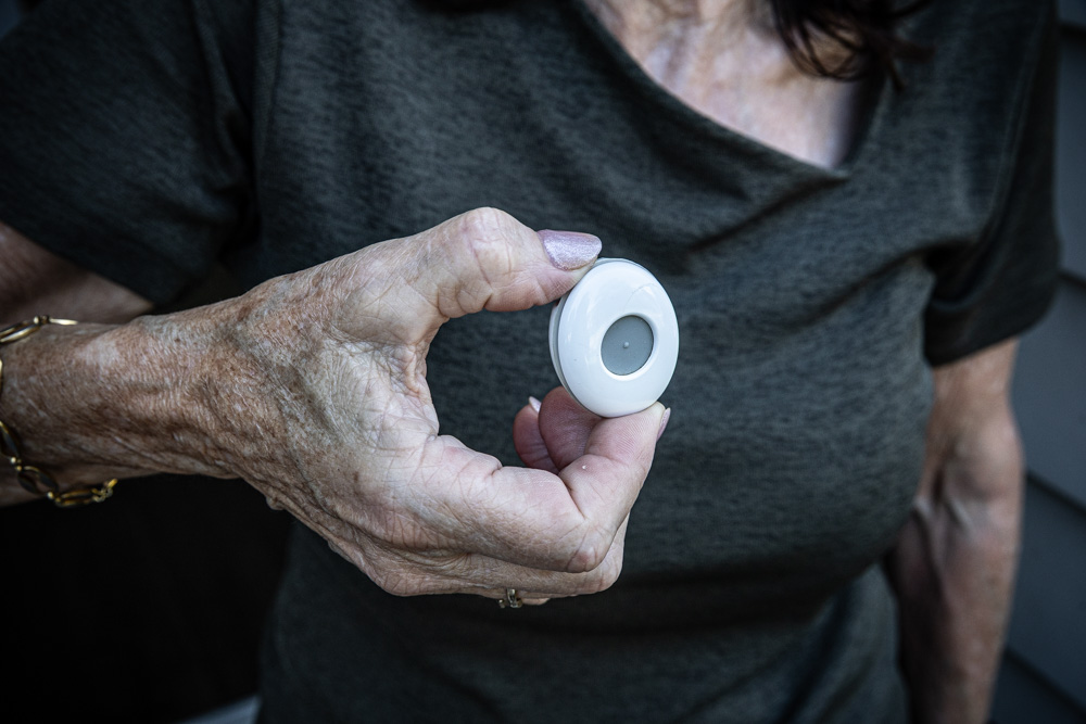 Alex Forrester holds her late mother Maureen's St John medical alarm. The 91-year-old wore it as a necklace and pressed it when she suffered a serious fall. Photo / Jason Dorday