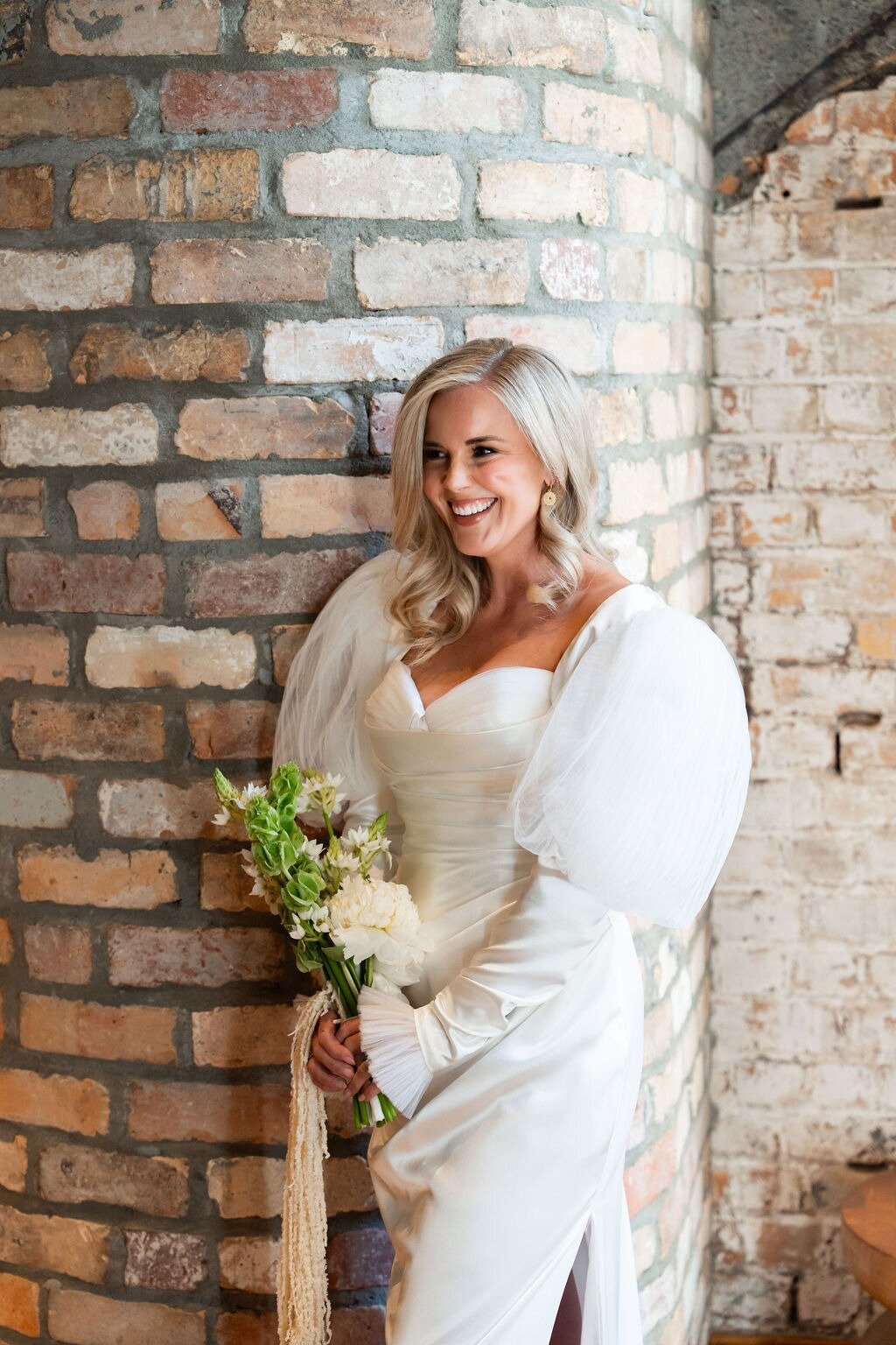 Gert Boult wears the Adrian with bolero: 'The bolero rises in bold, architectural volume – sleeves like carved clouds, ceremonial and modern.' Photo / Supplied