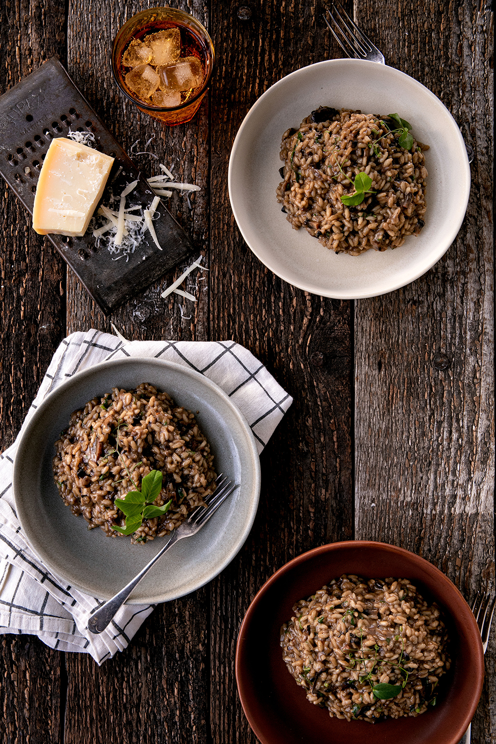 Arborio rice, fermented black garlic and mushrooms meet in this satisfying meal. Photo / Babiche Martens