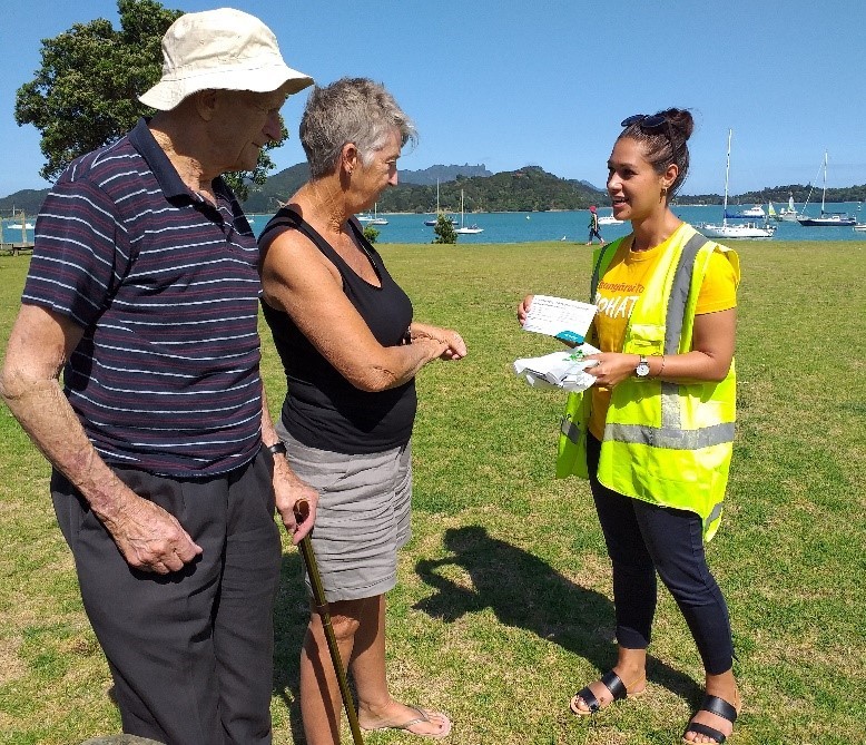 Freedom Camping Ambassador Nicole Stanton gives out information to freedom campers at Parua Bay.