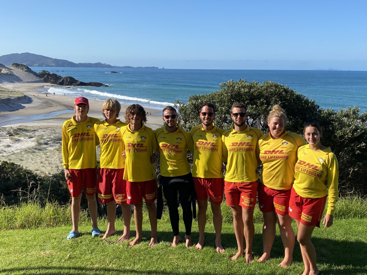 Whangārei Heads surf lifeguards involved in Sunday's rescue. From left: Oscar Boyd, Charlie Parker, Taha McLean Saad, Perry Thomas, John-Michael Swannix, Max Stackhouse, Hannah Lugtigheid, and Lily-Rose Dubost. Photo / Supplied