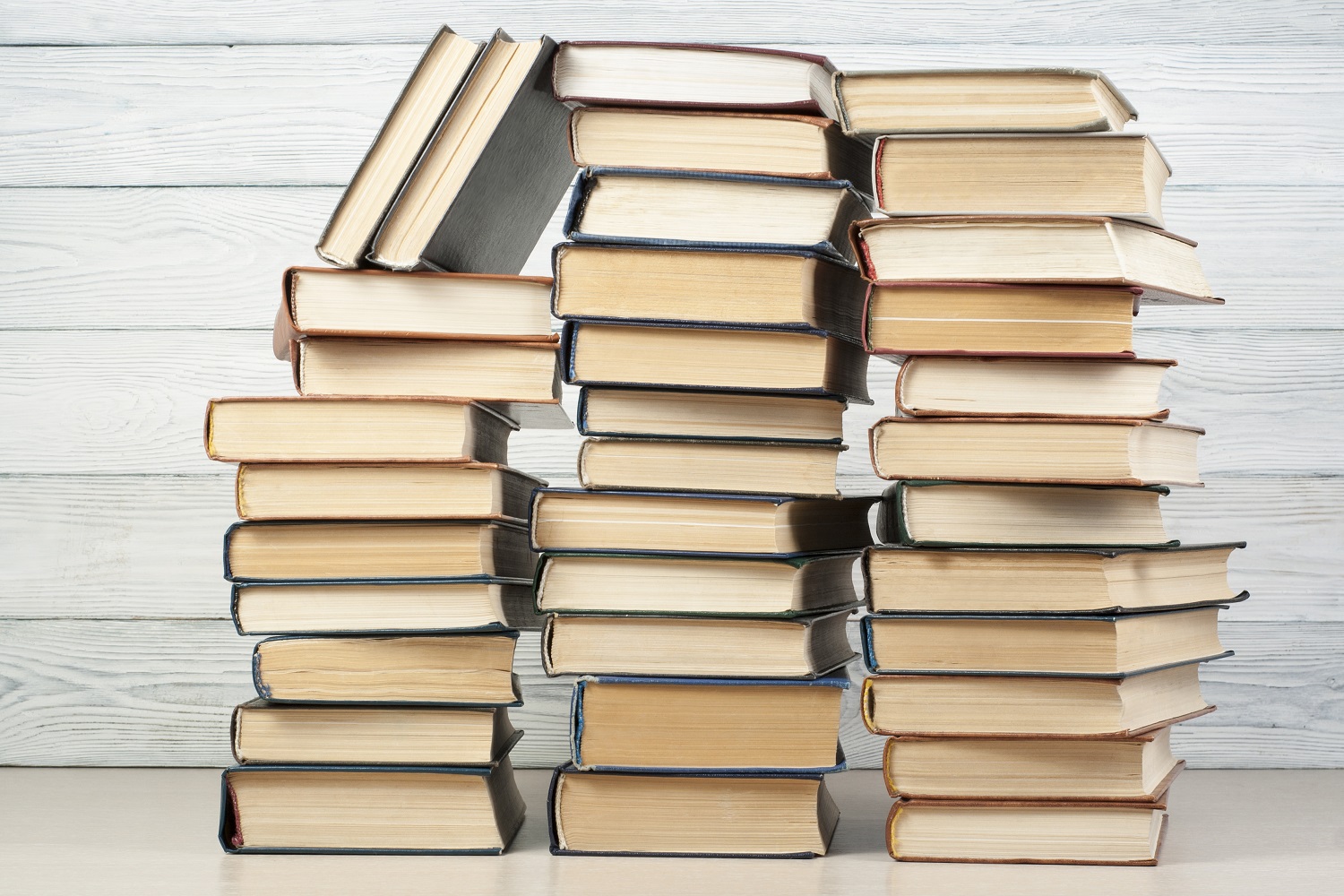 Stack of books piling up? There are many ways to read more in 2024. Photo / Getty Images