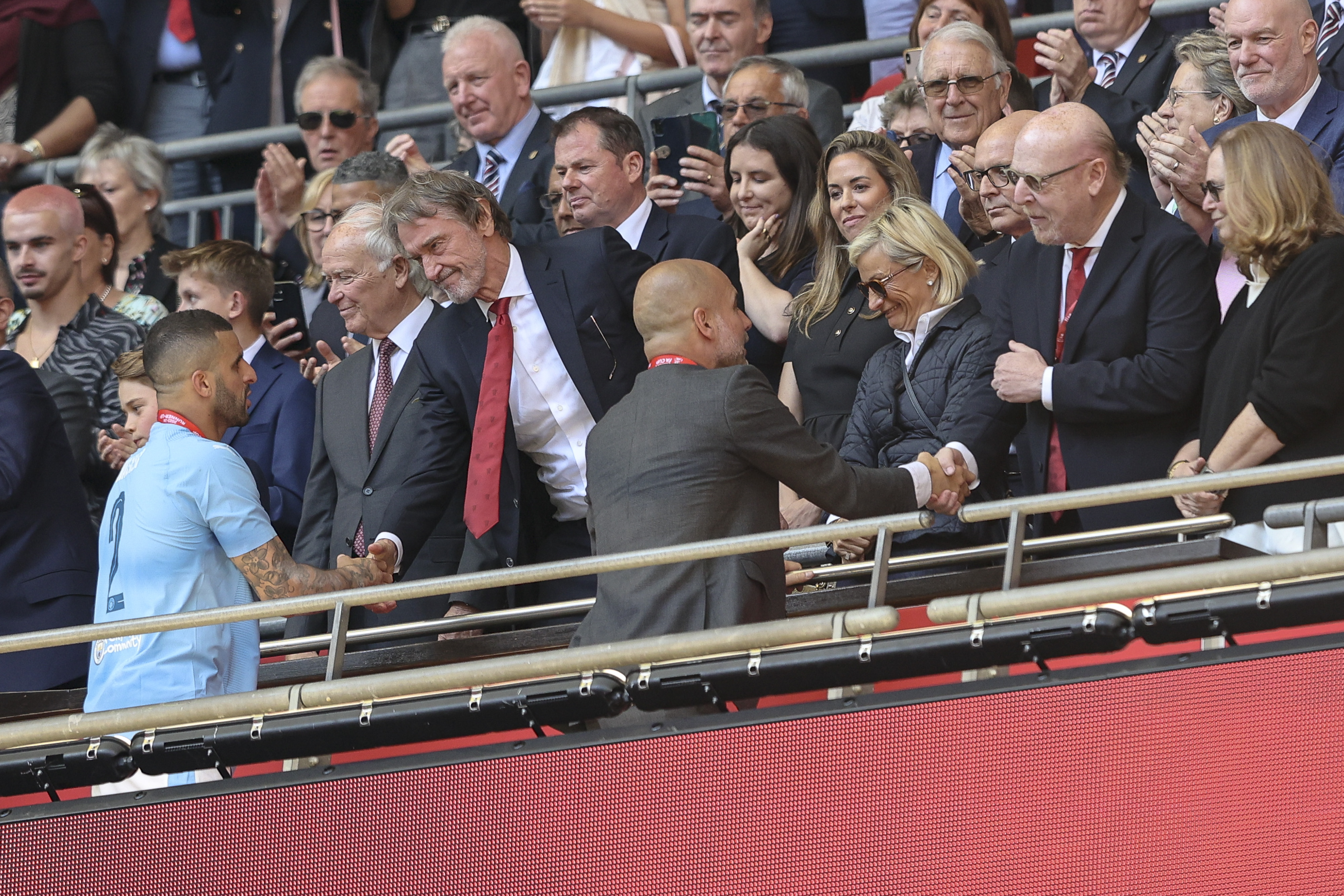 Sir Jim Ratcliffe and Avram Glazer with Head Coach Pep Guardiola and Kyle Walker of Manchester City after United's 2-1 win as HRH Prince William and Prince George look on. Photo / Getty Images