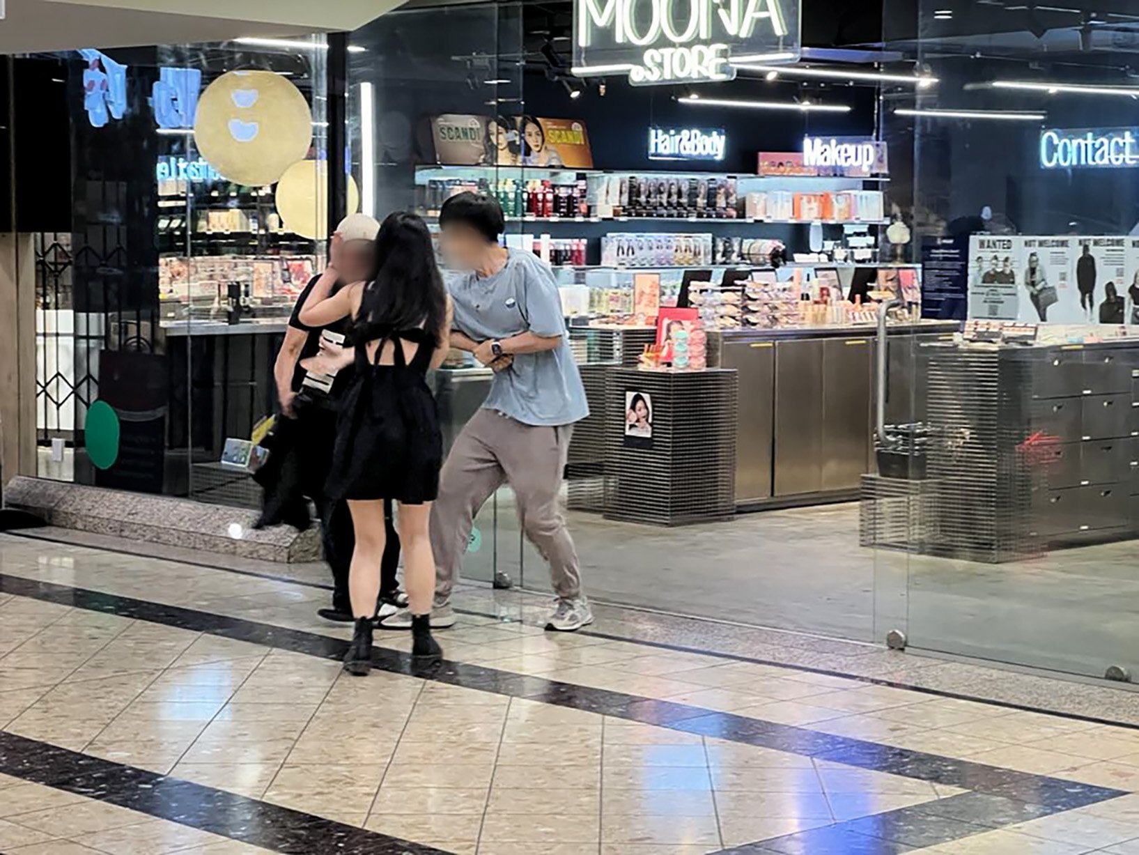 Business owners in the Mid City Mall in downtown Auckland attempt to apprehend a person after an item was allegedly stolen.