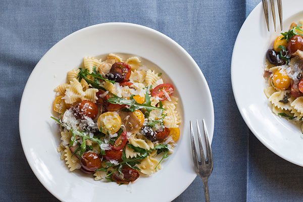 Farfalle with pan-fried bacon, cherry tomatoes, wilted rocket and parmesan  - NZ Herald