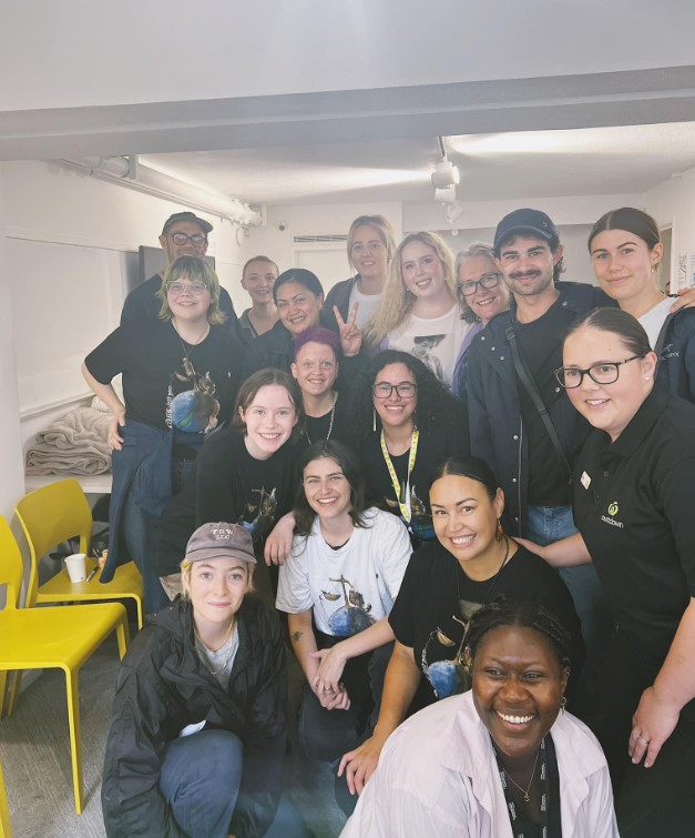 Lorde got stuck in to help Auckland flood victims in January, posing here with MP Chlöe Swarbrick and other volunteers at Ellen Melville Hall in Auckland. Photo / via Facebook