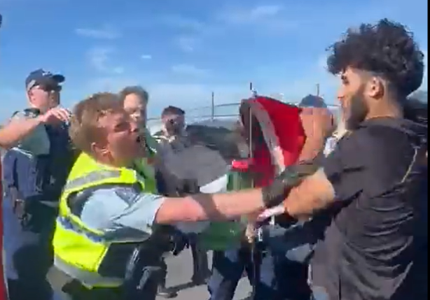 Pro-Palestinian protesters clash with police outside the Port of Auckland.