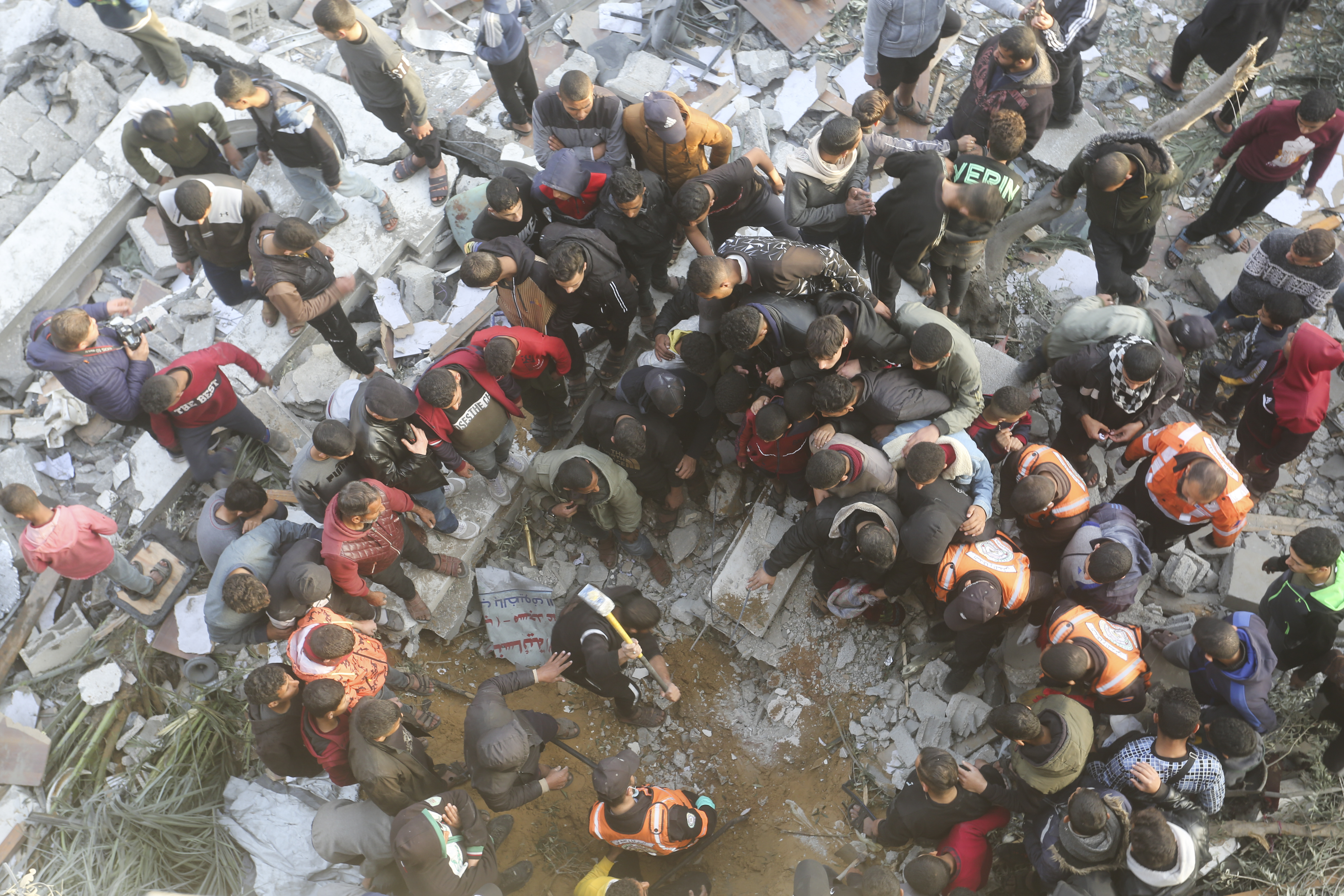 Palestinians look for survivors at a mosque destroyed in an Israeli strike in Rafah, Gaza Strip. Photo / AP