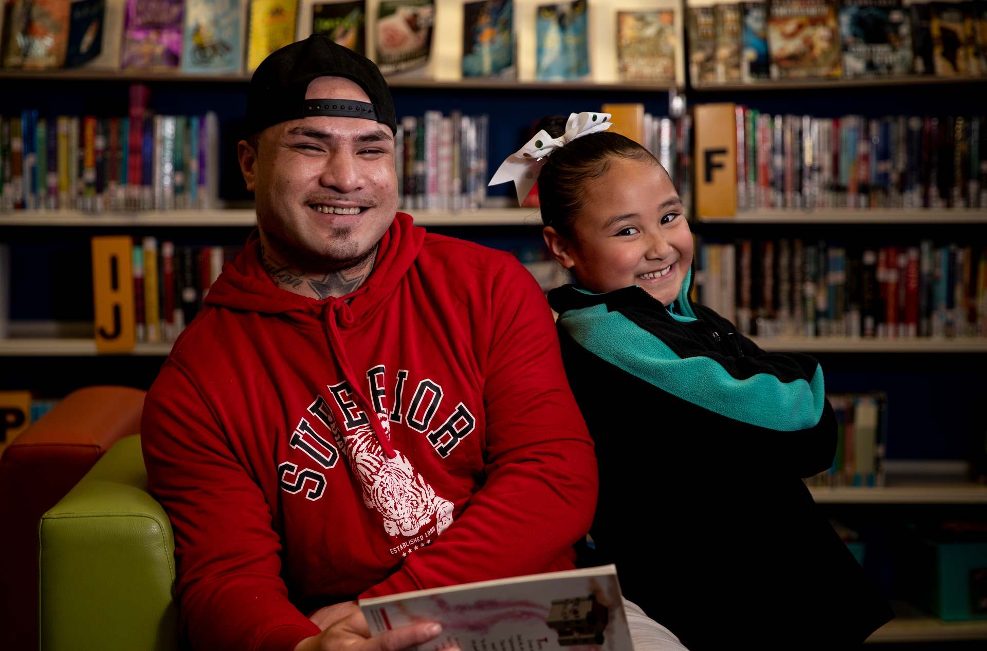 Poutasi Lemuelu says he's shocked at how fast his daughter, Peyton Poutasi (6) has learned to read and write since starting at Robertson Road School in Māngere this year. Photo / Dean Purcell