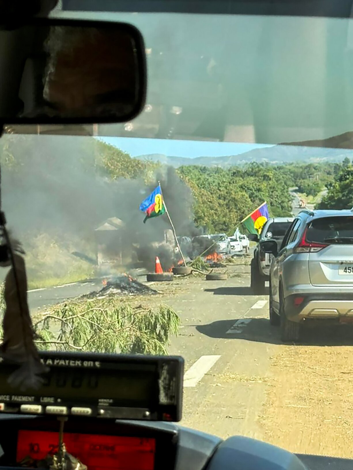 Burning tyres on a road in Noumea, New Caledonia, as the country experiences widespread rioting. Photo / Campbell Ross