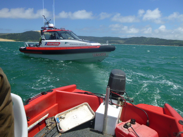 Coastguard Hokianga's rescue boat approaches the fishers (and their dog) in trouble off the Hokianga bar. Photo / supplied