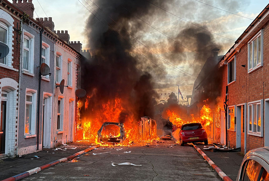 Vehicles set on fire by protesters on Lendrick Street in Belfast, as disorder flared in response to Monday night's stabbing attack in the city. A 30 year-old man arrested in connection with the Belfast stabbing attack has been charged with attempted murder and will appear in court in the city on Wednesday, the Police Service of Northern Ireland has said. Picture date: Tuesday June 9, 2026. (Photo by PA/PA Images via Getty Images)