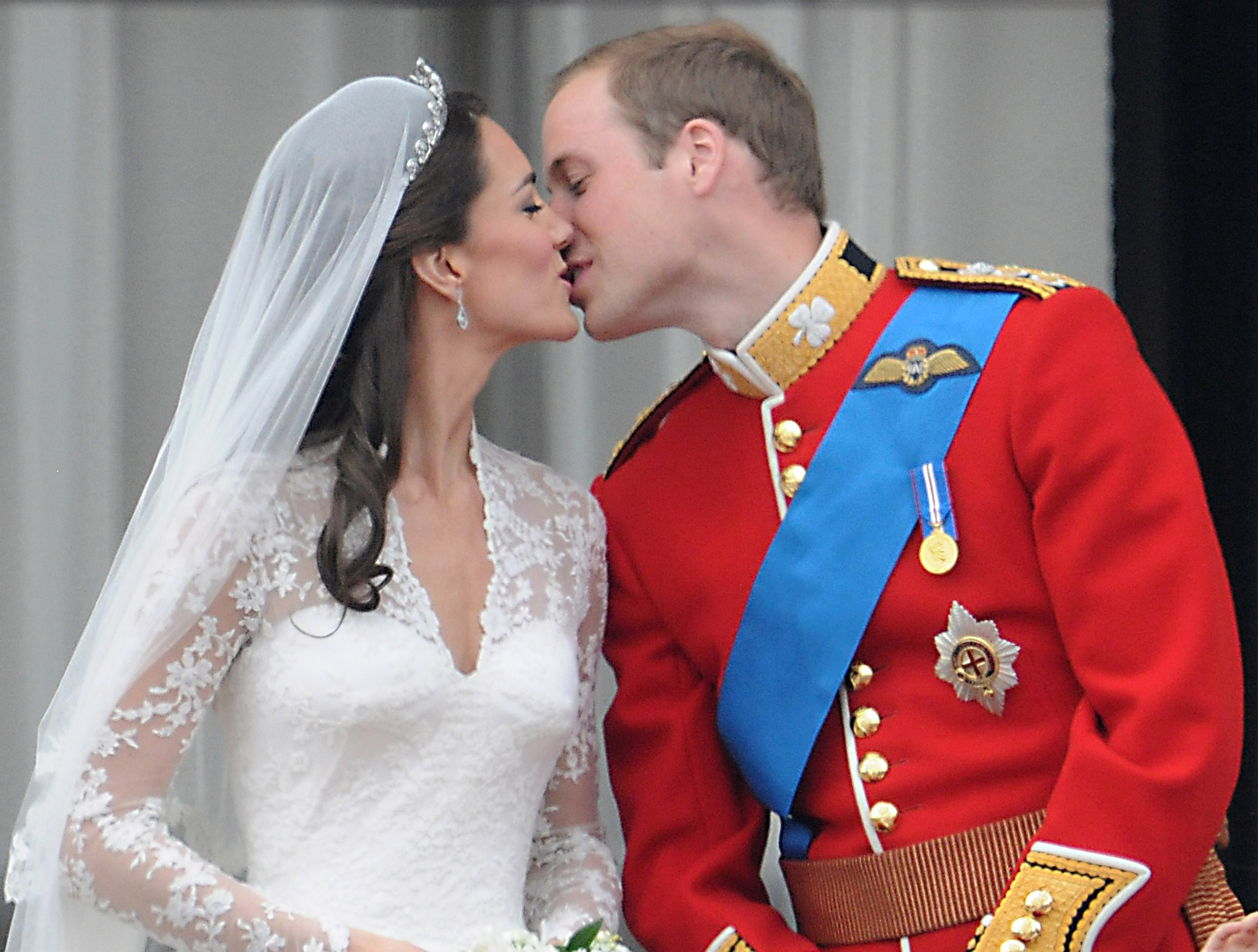 Kate Middleton and Prince William kiss on the balcony at Buckingham Palace after their wedding in 2011. Photo / George Pimentel, WireImage