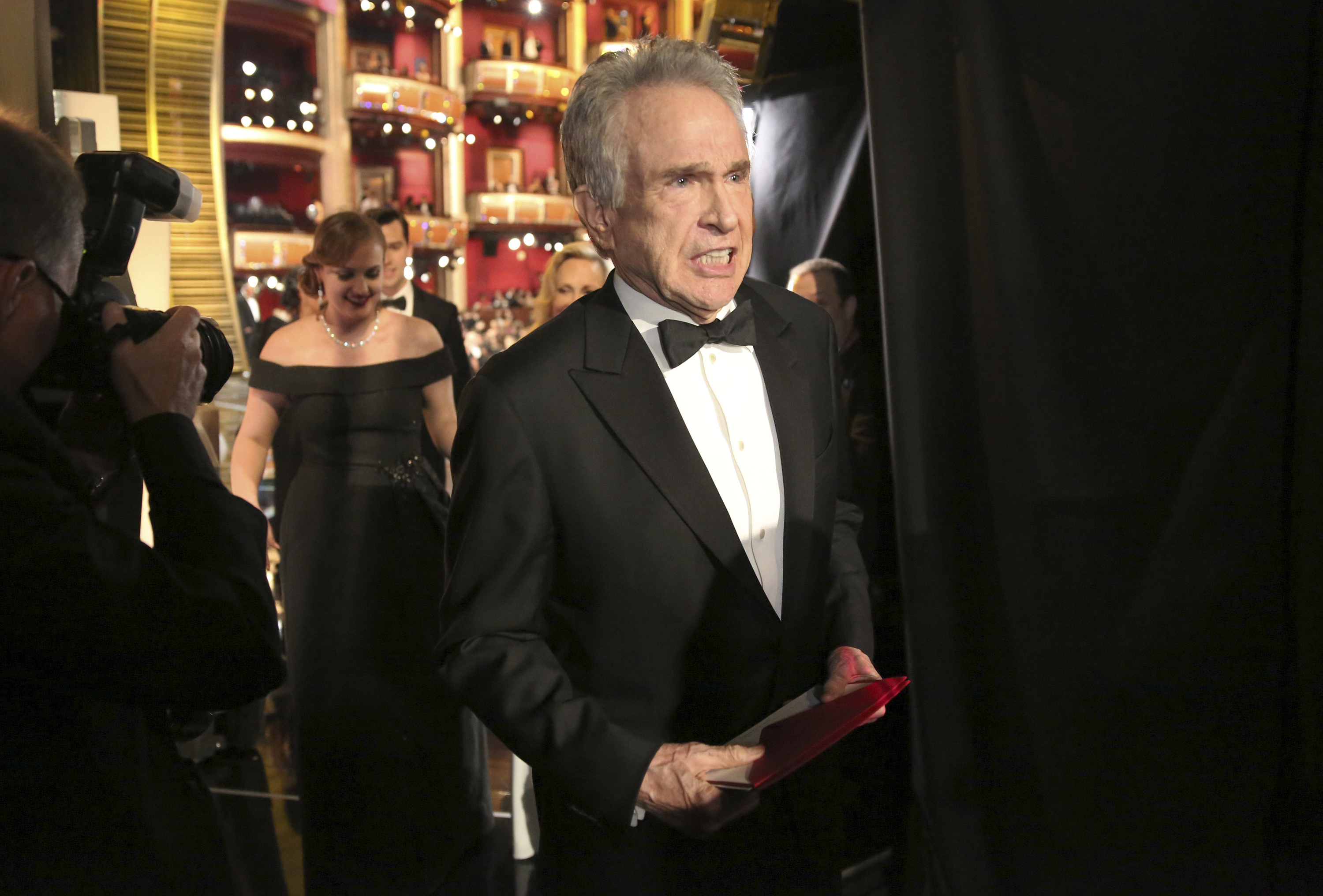 Warren Beatty exits the stage after announcing the wrong award for best picture. Photo / AP