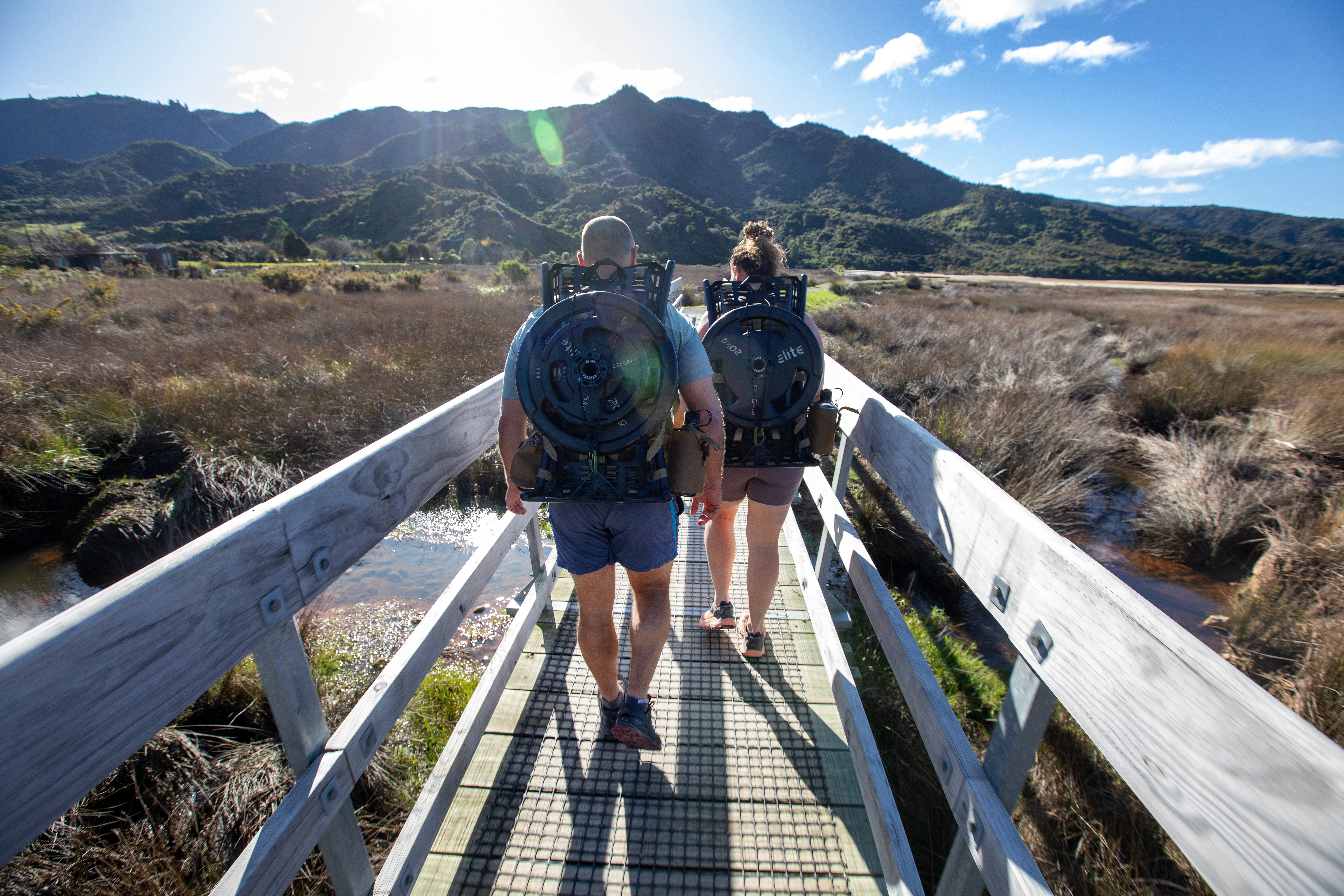 Former NZSAS corporal Gregg Johnson and partner Nicole Walker with 25kg weights on pack frames heading out for a run. Photo / Tim Cuff