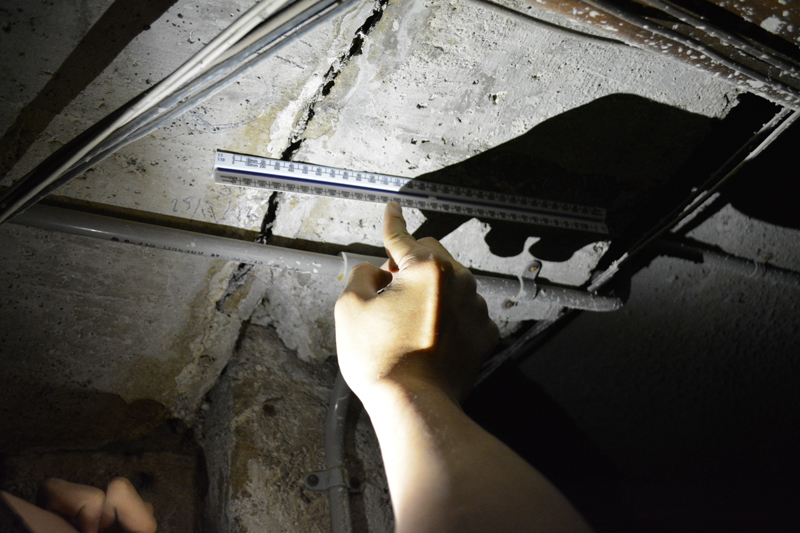 A new crack in the ceiling of the mud bath basement.