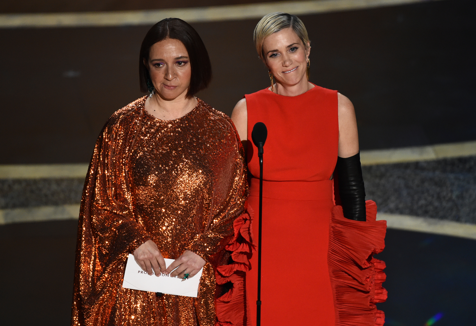 Maya Rudolph, left, and Kristen Wiig present the award for best production design. Photo / AP