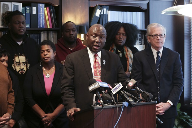 Attorney Ben Crump speaks while surrounded by family and friends of the Topps supermarket shooting during a press conference in Buffalo. Photo / AP