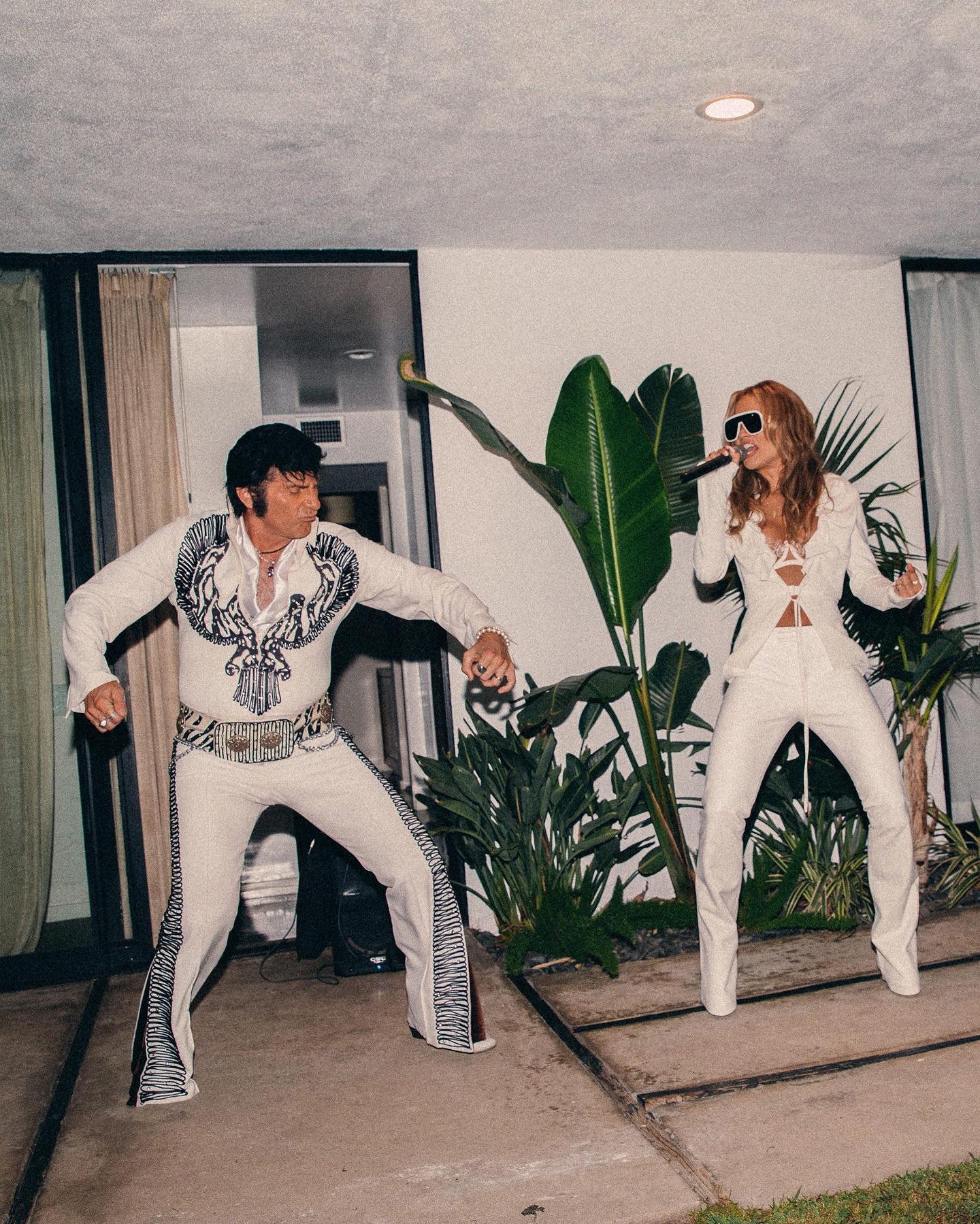 The couple were surprised with an Elvis impersonator who offered music for proceedings. Photo / Instagram