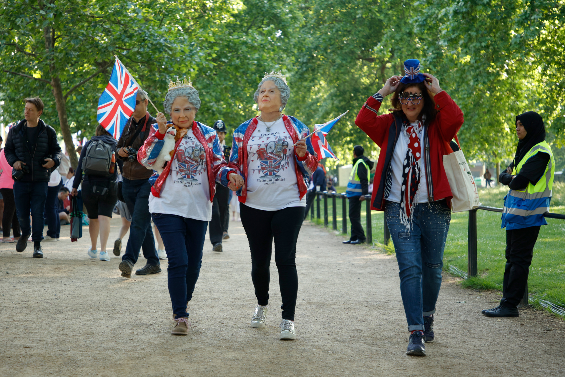 Royal fans walk alongside the Mall leading to Buckingham Palace in London. Photo / AP