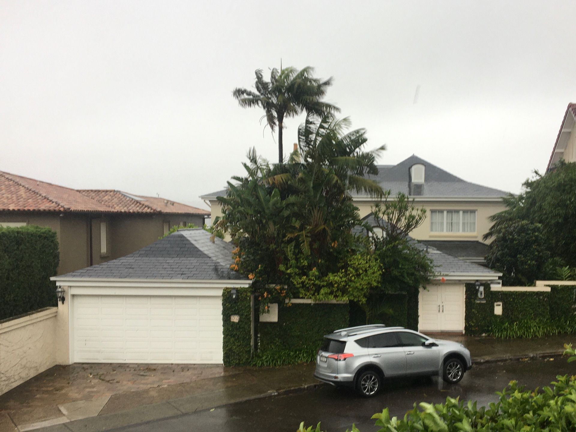 Sir Ron Brierley's home in Point Piper, Sydney, during a fierce storm on the eve of his first court hearing over charges of possessing child pornography. Photo / David Fisher