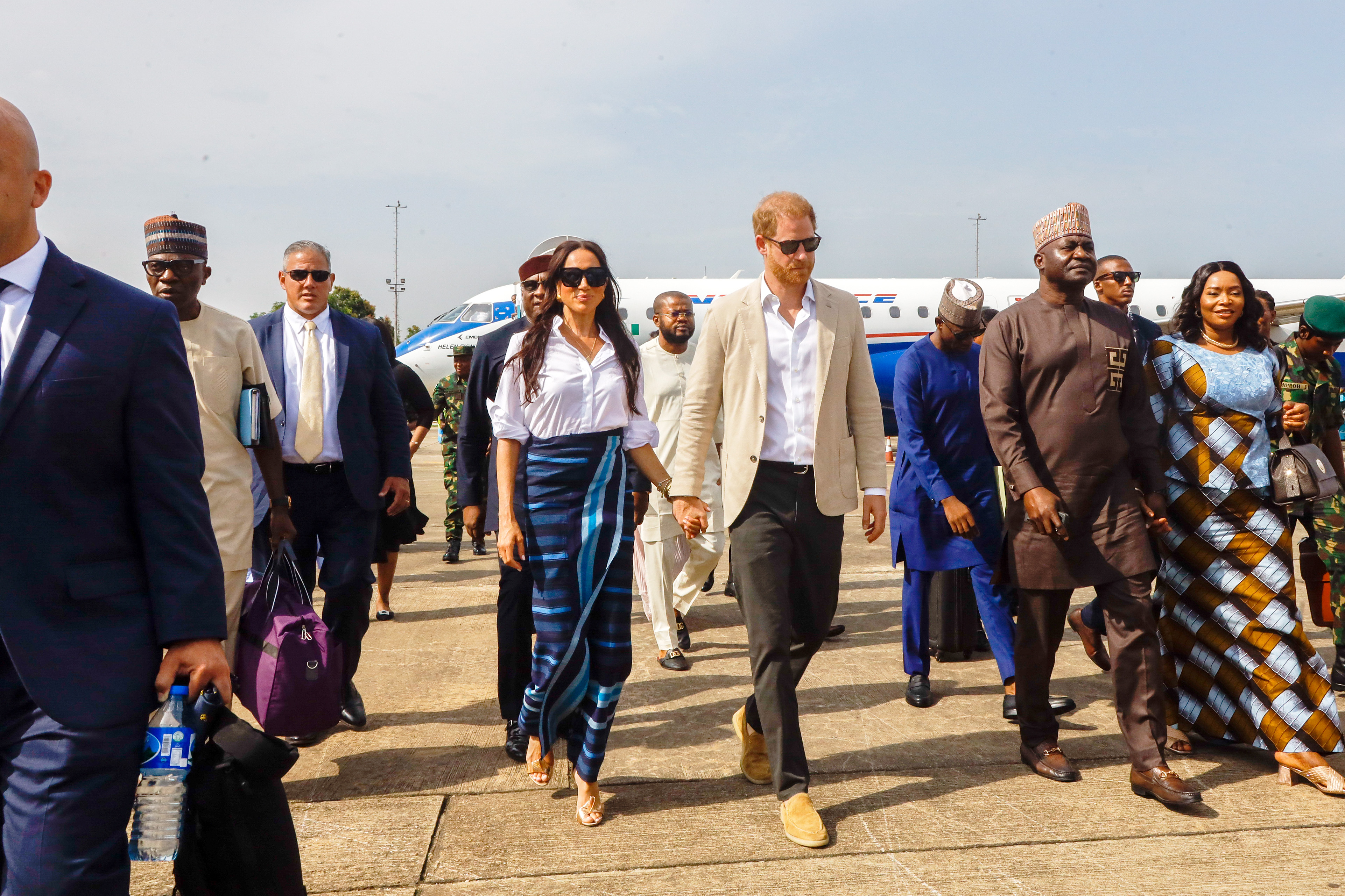 Prince Harry, Duke of Sussex and Meghan, Duchess of Sussex arrive at Lagos airport for an official state welcome this week. Photo / Getty Images