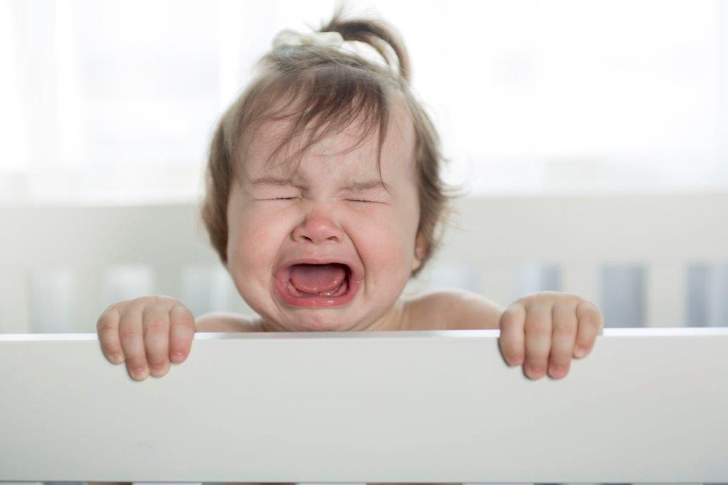 A baby crying is one of the hardest sounds to ignore. Photo / 123rf