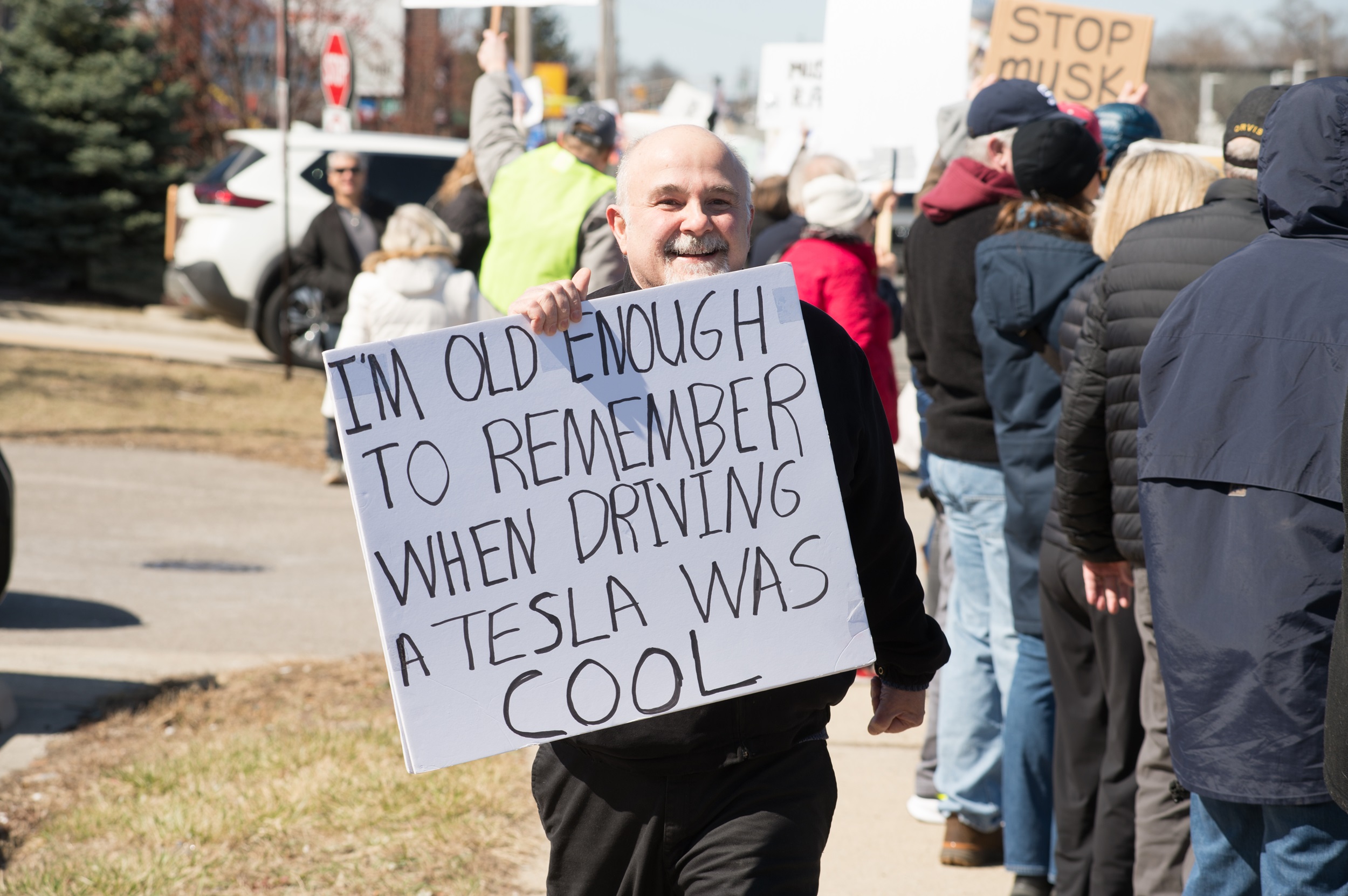 A protester outside a Tesla showroom in Chicago on March 22. Photo / Getty Images