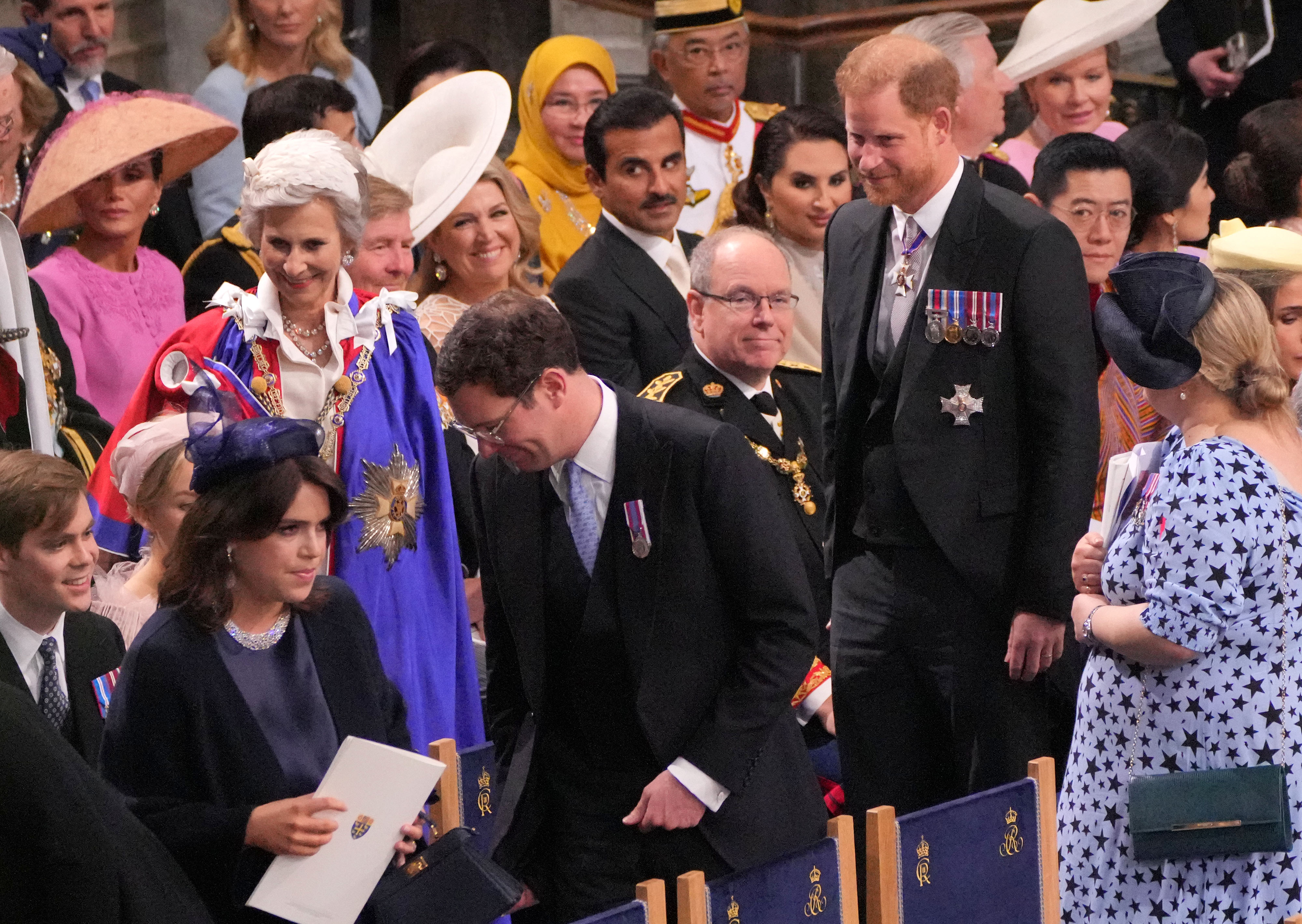 Princess Eugenie and Jack Brooksbank with Prince Harry at the coronation ceremony. Photo / Getty Images