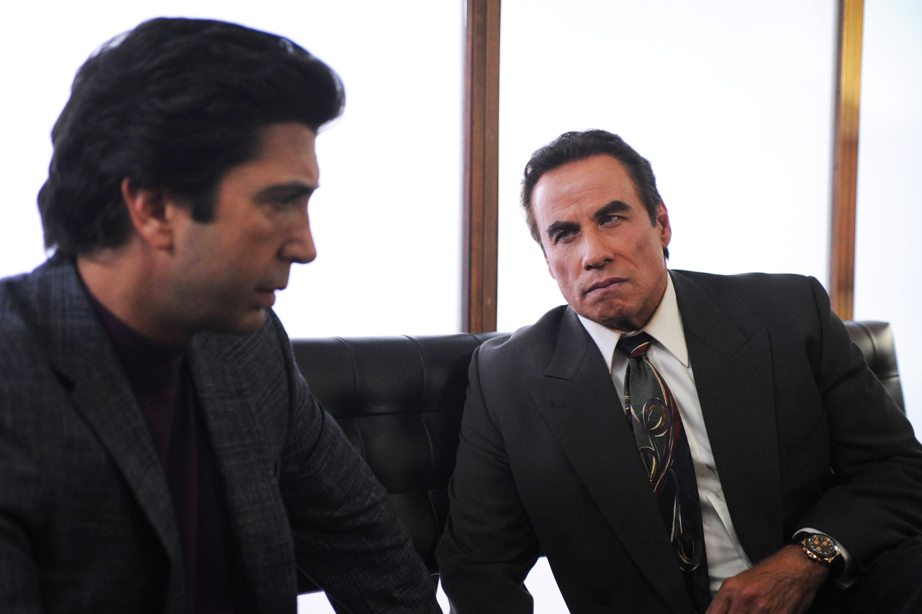 David Schwimmer as Robert Kardashian, John Travolta as Robert Shapiro.