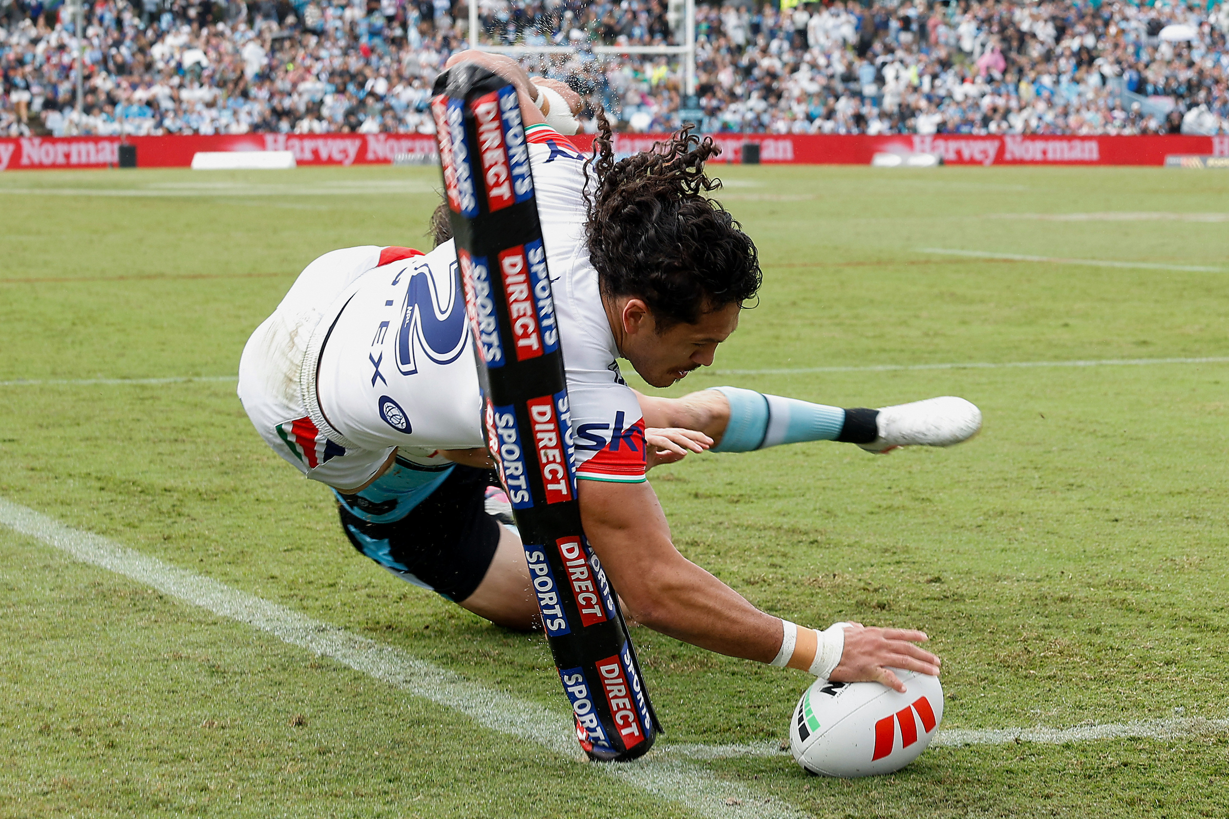 Dallin Watene-Zelezniak of the Warriors scores a try during the match with Cronulla. Photo / Photosport