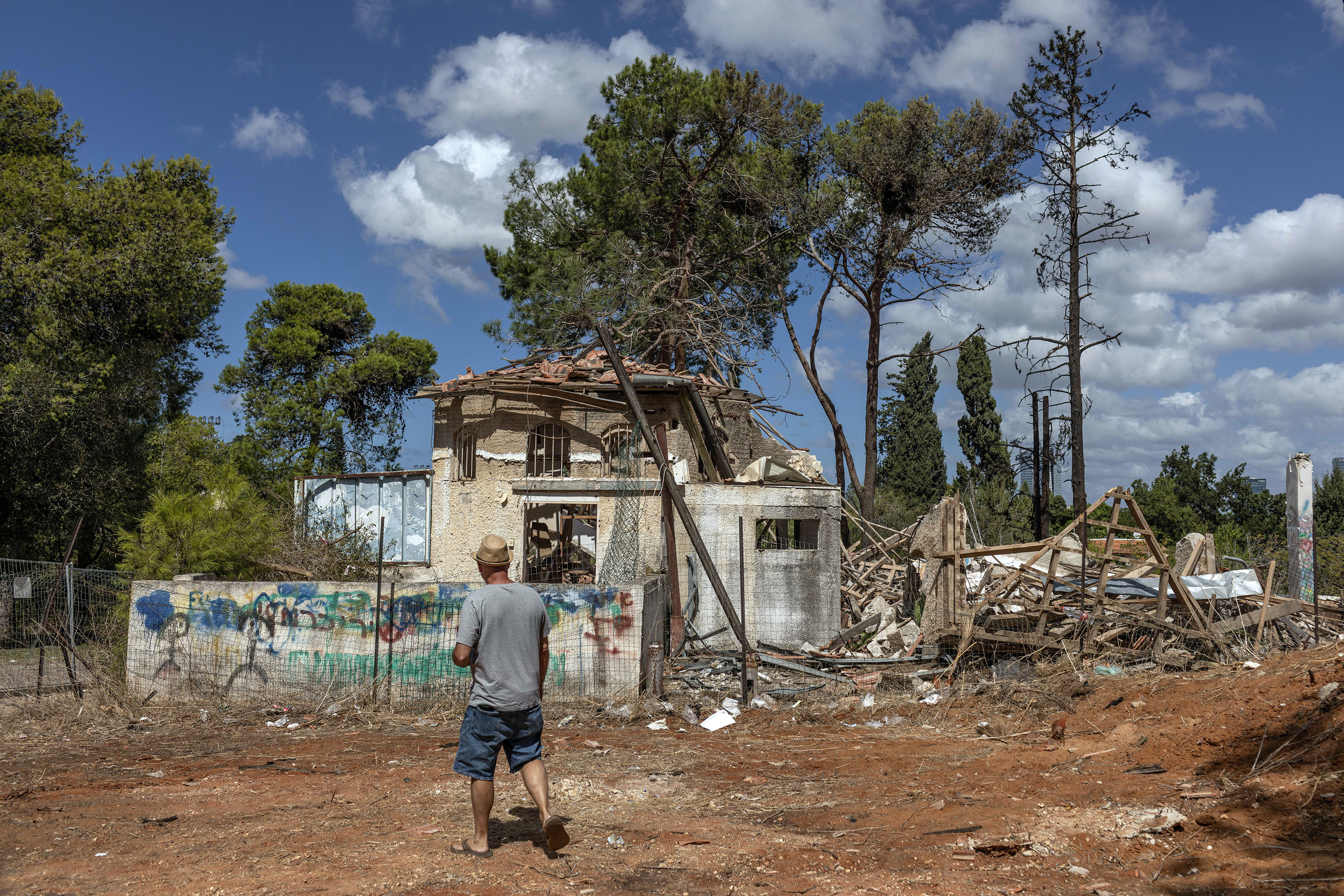 A man surveys the wreckage of a building that was destroyed by an Iranian missile attack in Hod Hasharon, near Tel Aviv, Israel. Photo / Avishag Shaar-Yashuv, The New York Times