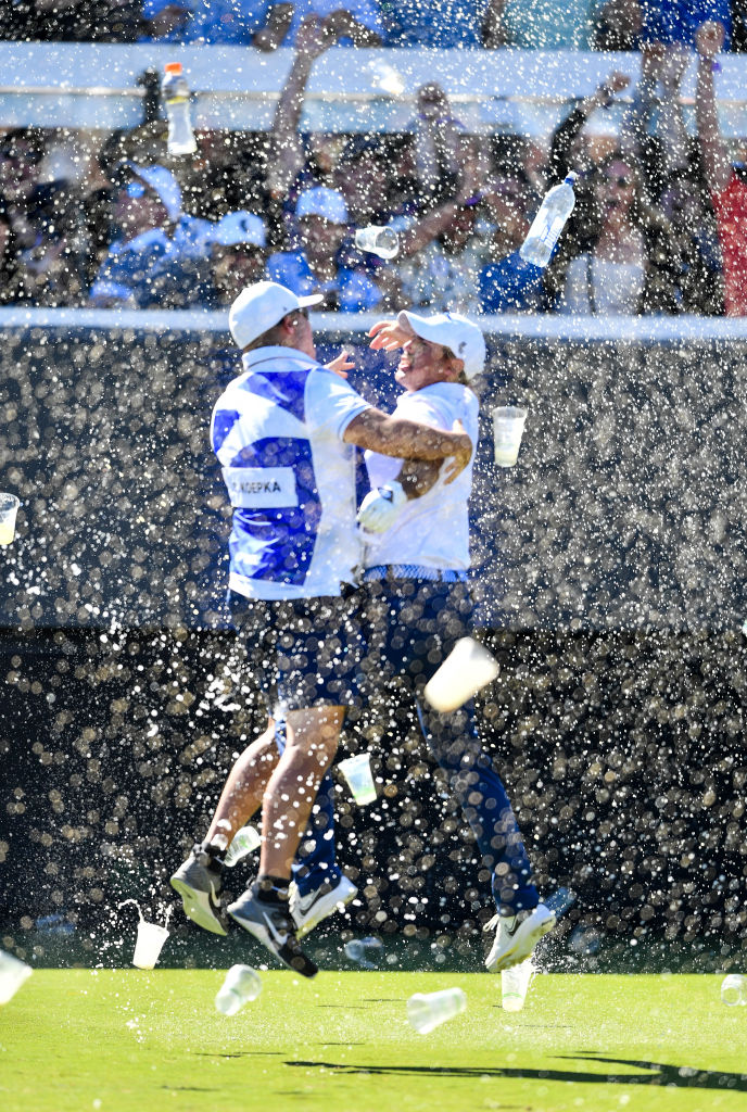 Chase Koepka celebrates a hole-in-one with his caddie on the 12th, showered in beer from the crowd, at LIV Golf Adelaide last year. Photo / Getty Images