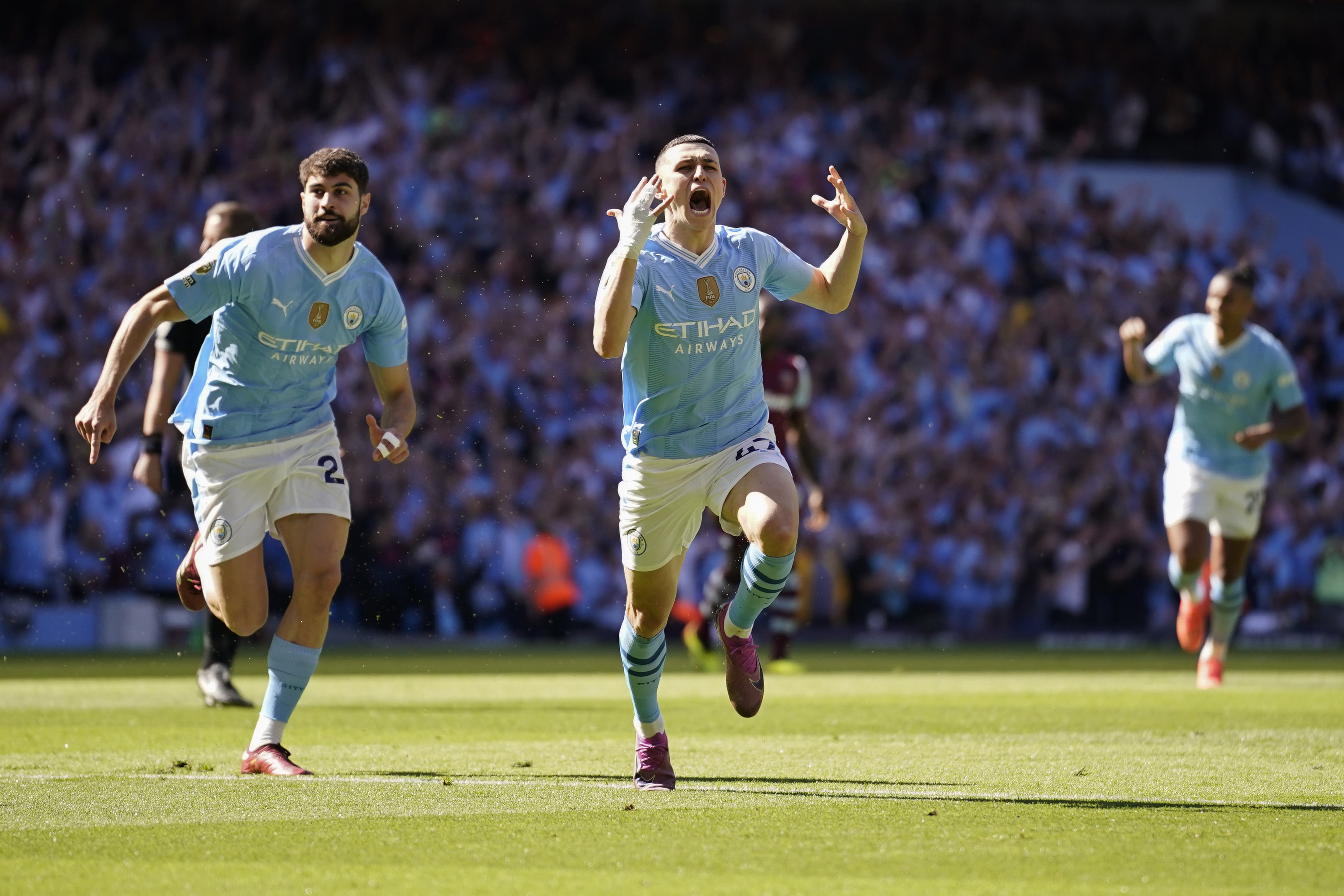 Manchester City's Phil Foden celebrates after scoring his side's opening goal during the English Premier League soccer match between Manchester City and West Ham United. Photo / AP