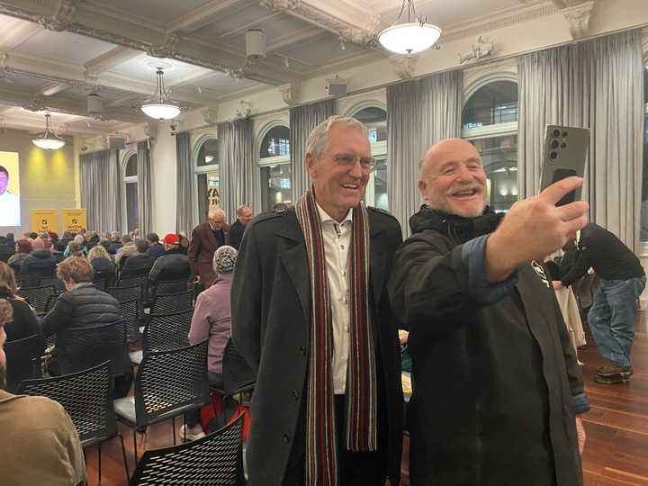Mayoral candidate Graham Bloxham taking a selfie with former broadcaster Peter Williams at Ray Chung's campaign launch for the Wellington mayoralty.