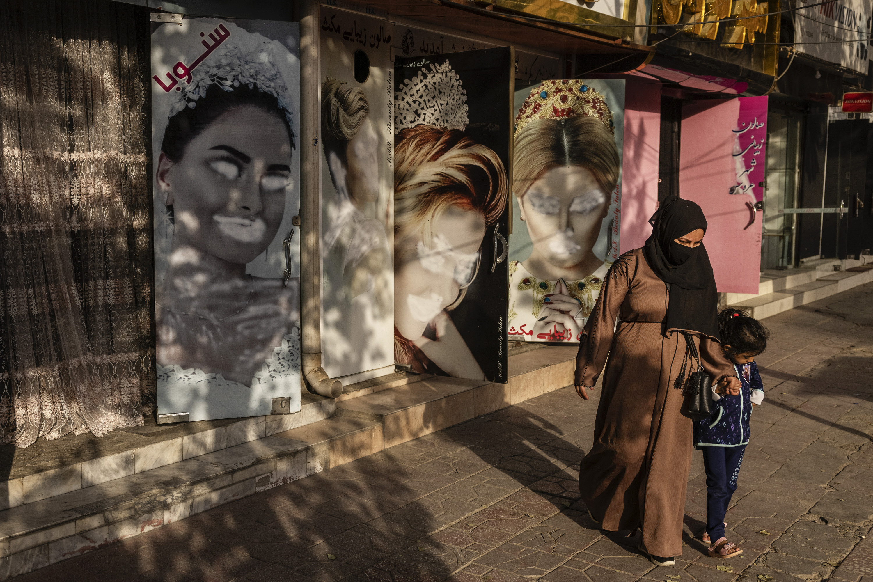 Defaced wall posters featuring beauty advertisements for women in Kabul. Photo / Victor J. Blue, The New York Times