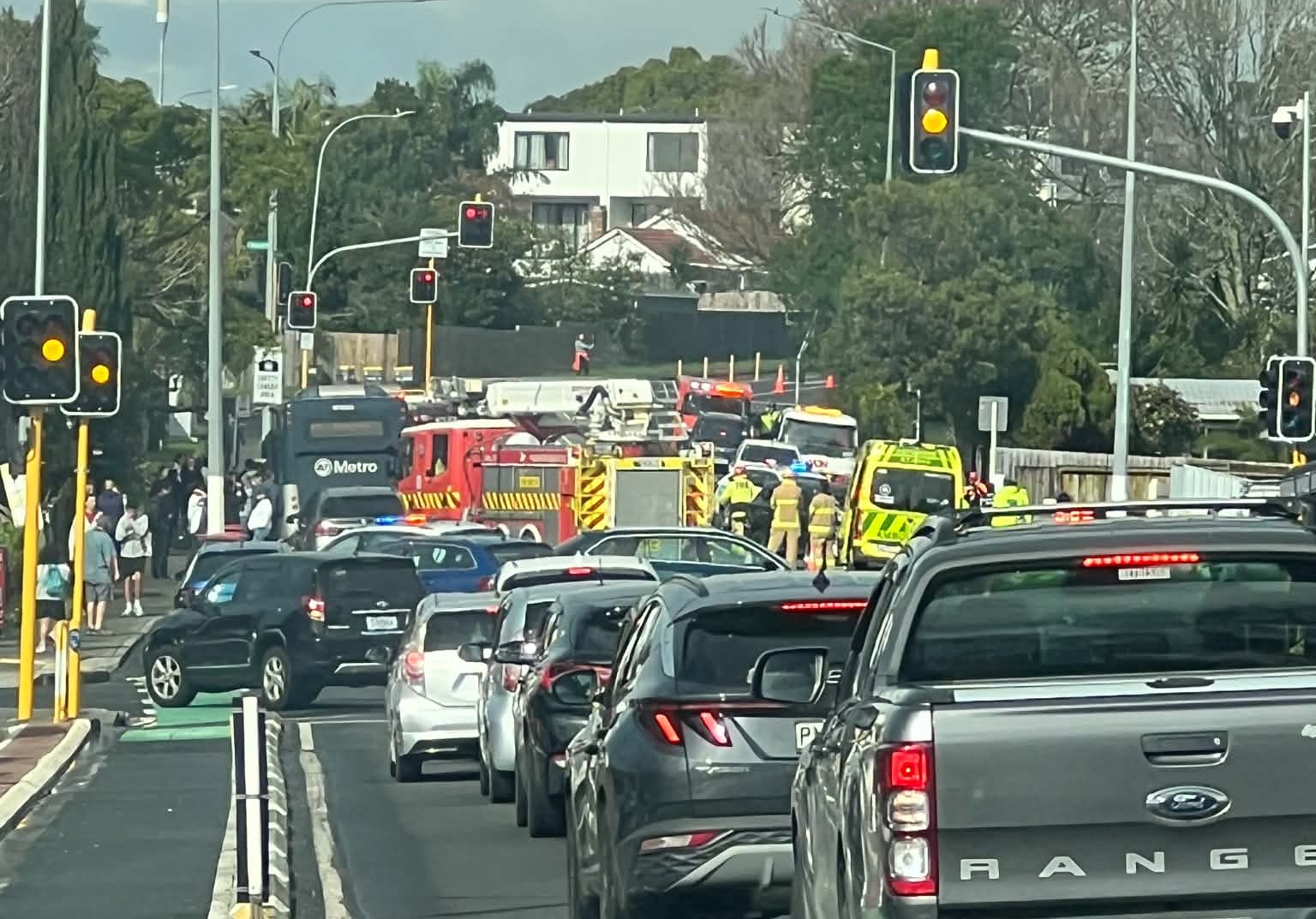 A crash involving a bus and two cars has halted traffic on Te Atatū Rd. Photo / Mia Angela Duindam