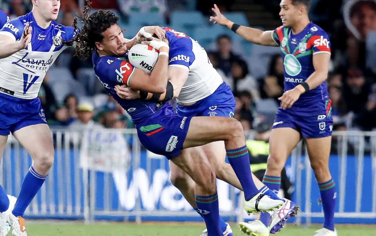 Dallin Watene-Zelezniak is driven back in a tackle against the Bulldogs