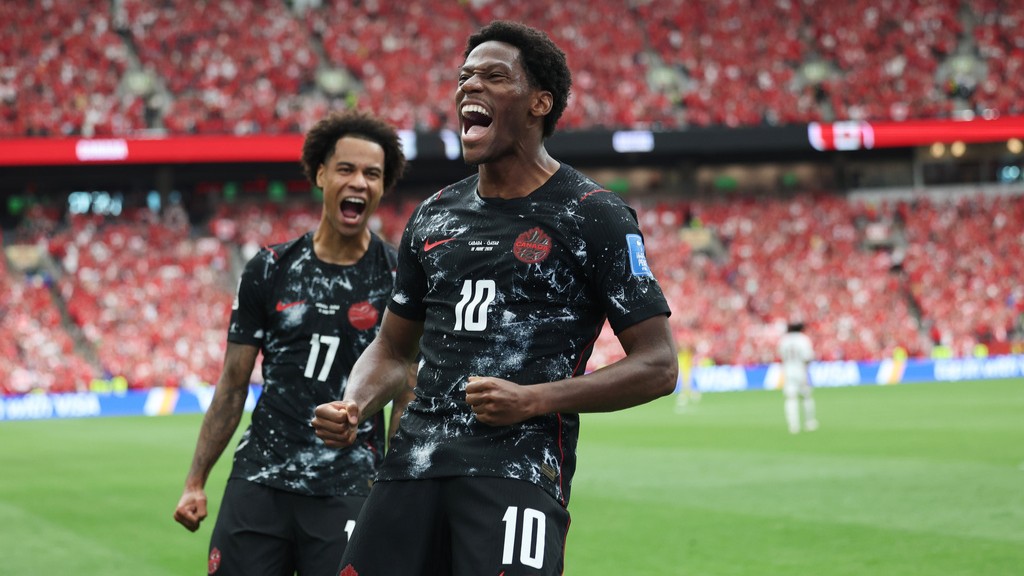 Canada's Jonathan David (10) celebrates after scoring their second goal during the World Cup Group B soccer match between Canada and Qatar.