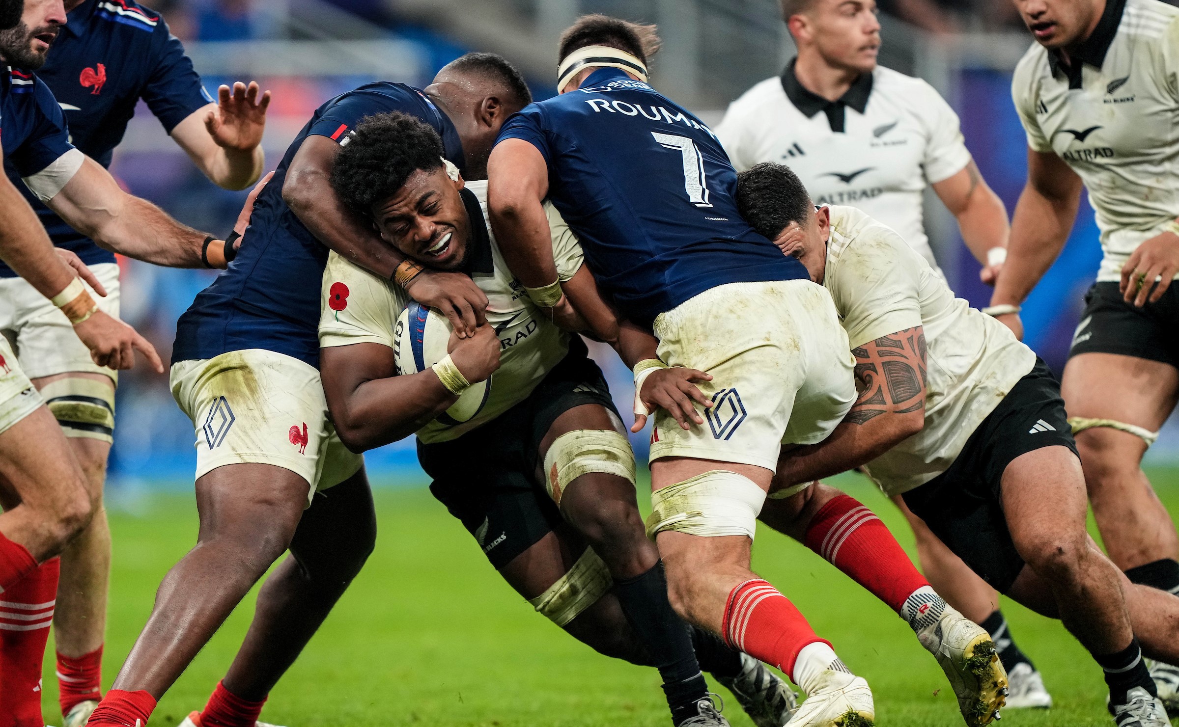All Blacks flanker and try scorer Peter Lakai is stopped by the French defence.