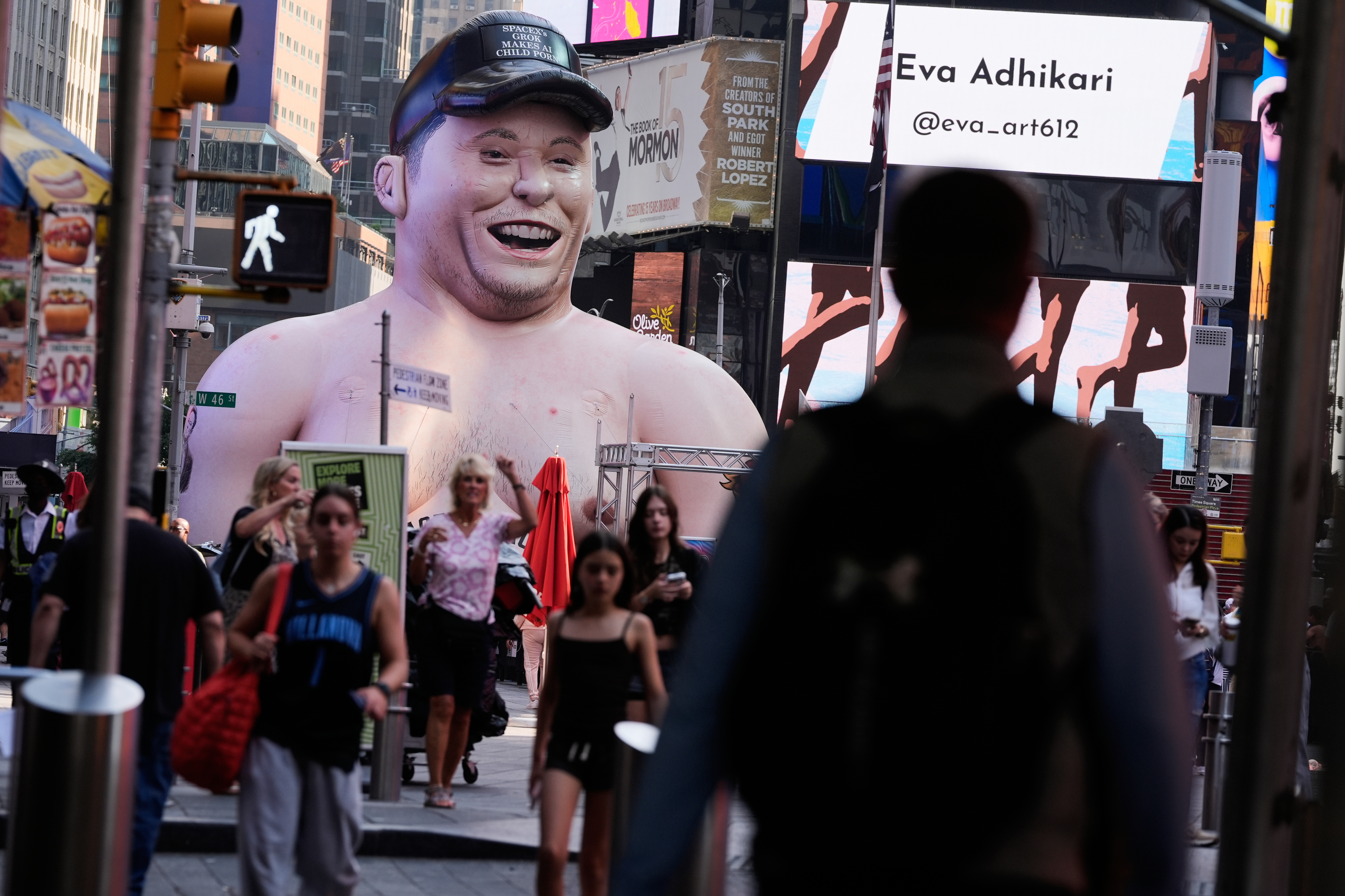 A large inflatable figure depicting Elon Musk stands in Times Square in New York on Thursday, June 11, 2026.