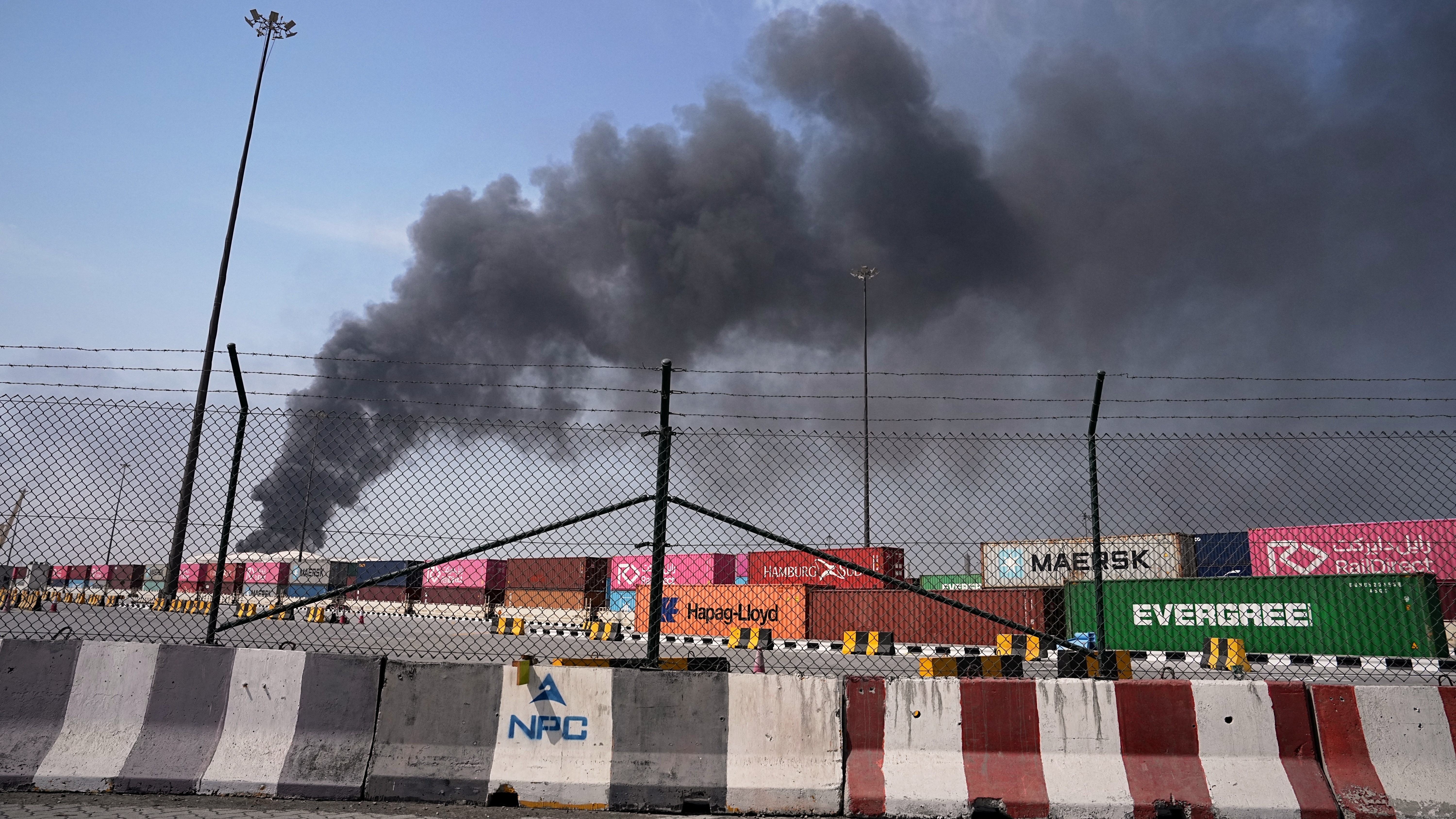 Smoke rises after an Iranian drone attack in the port area of Dubai, United Arab Emirates, March 1, 2026.