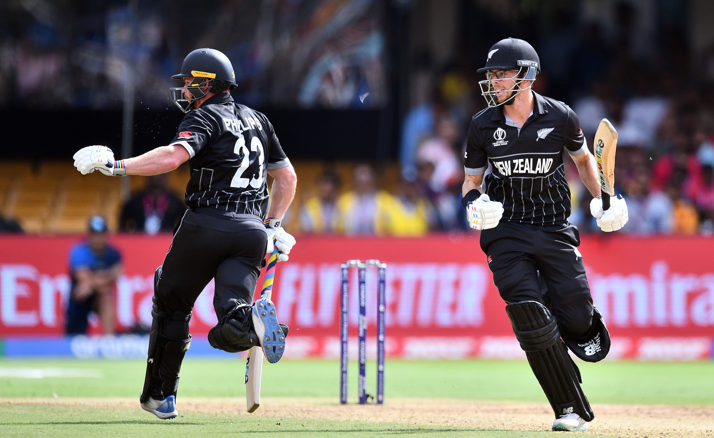 Glenn Phillips, left, and Mitchell Santner - not to be confused with the author - run a single against Pakistan at the World Cup.