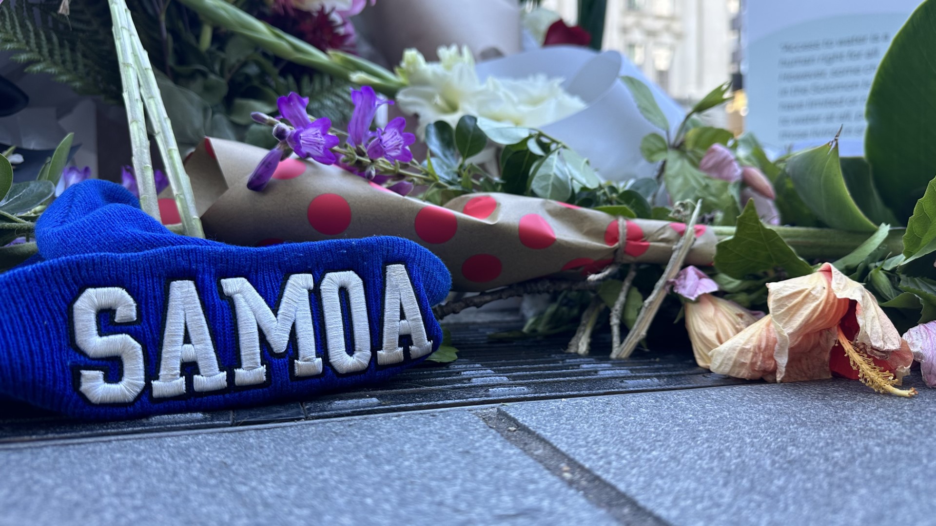 Flowers and a Samoa beanie tribute to Efeso Collins at Britomart square.