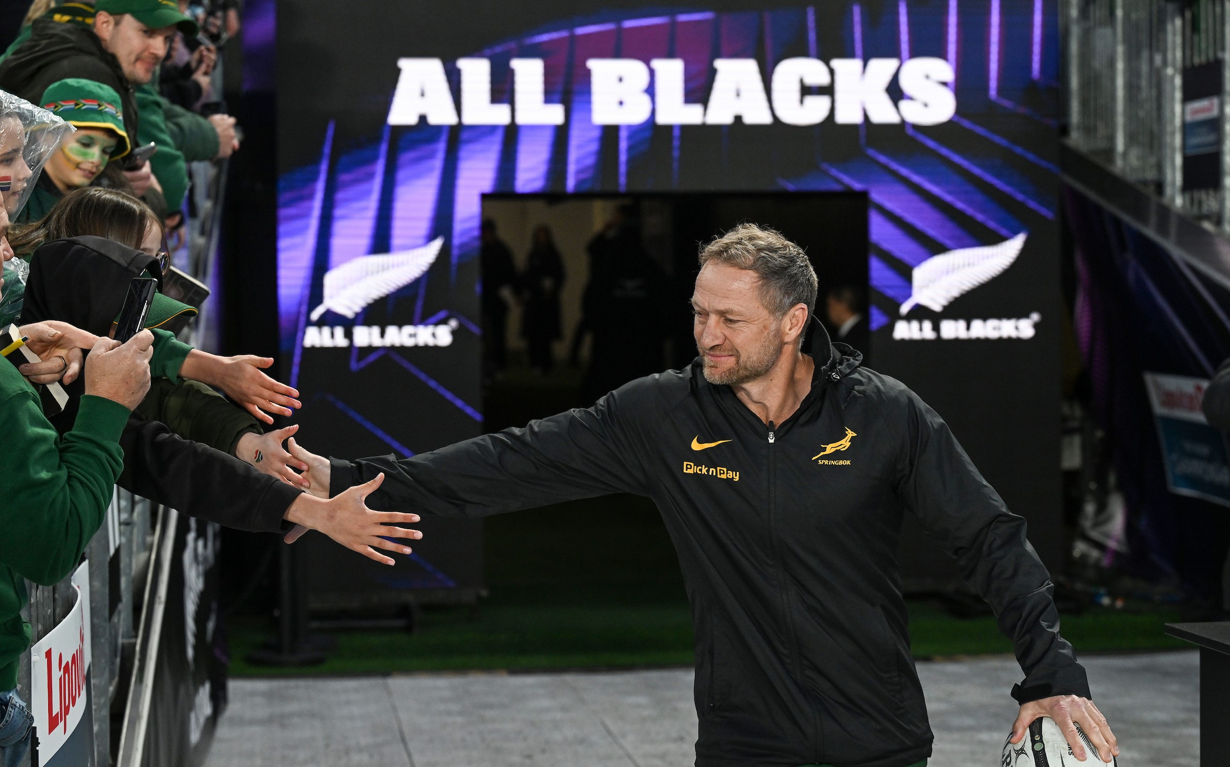 Springboks assistant coach Tony Brown greets fans before his side's defeat to the All Blacks at Eden Park last year.